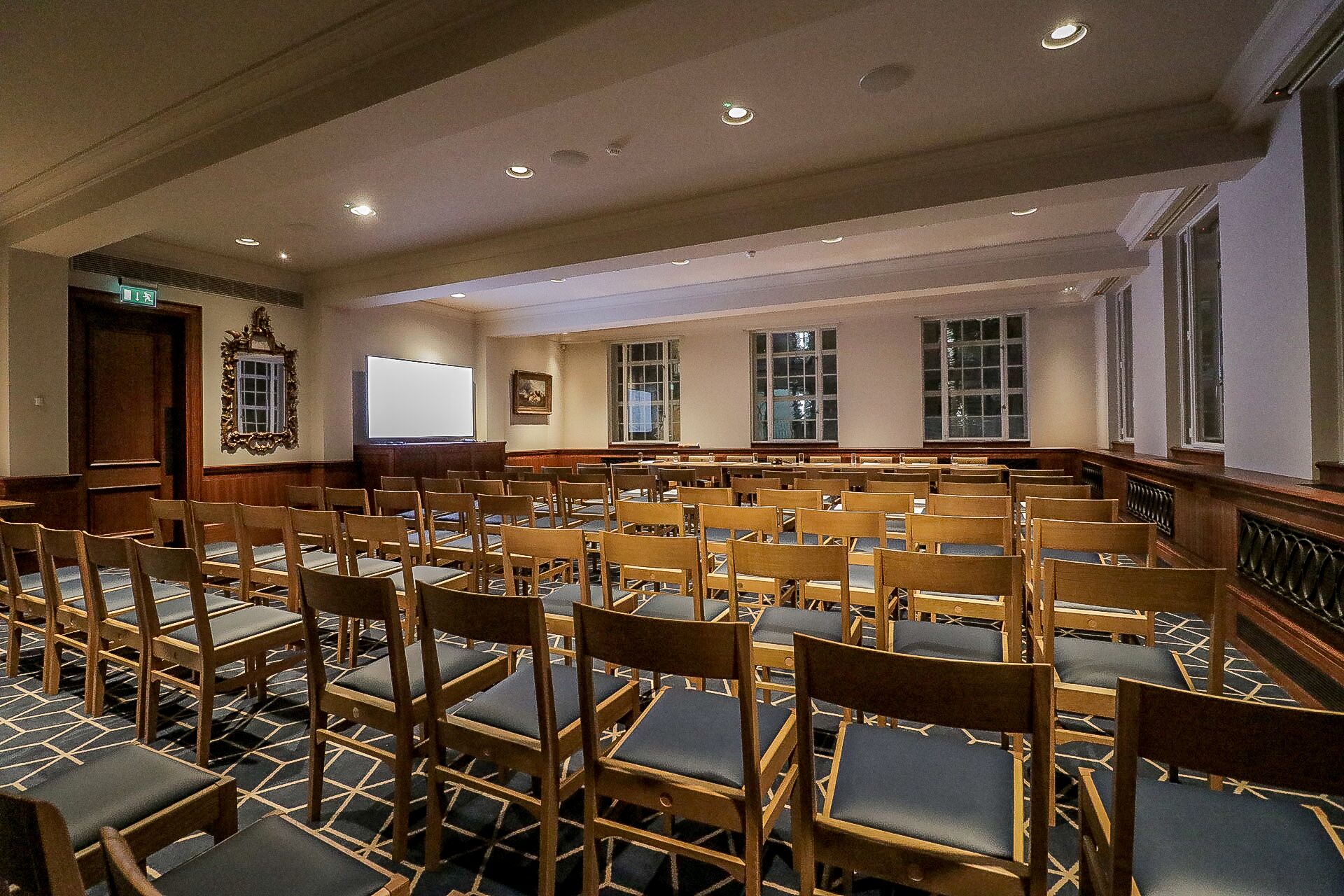 Meeting room at Court Suites, 87 Barts Close, ideal for presentations and seminars.