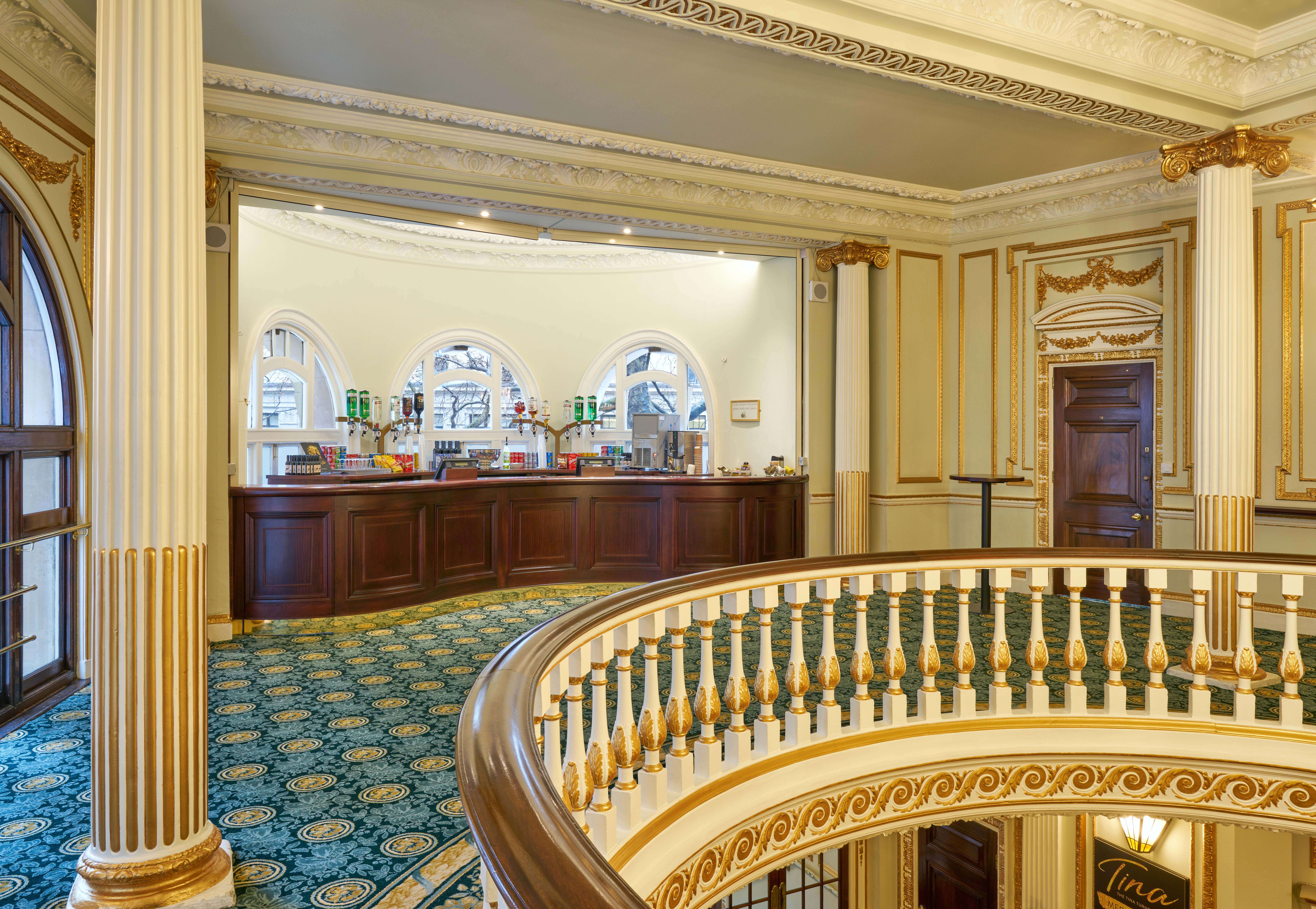 Aldwych Theatre Auditorium lobby with elegant columns, ideal for events and networking.