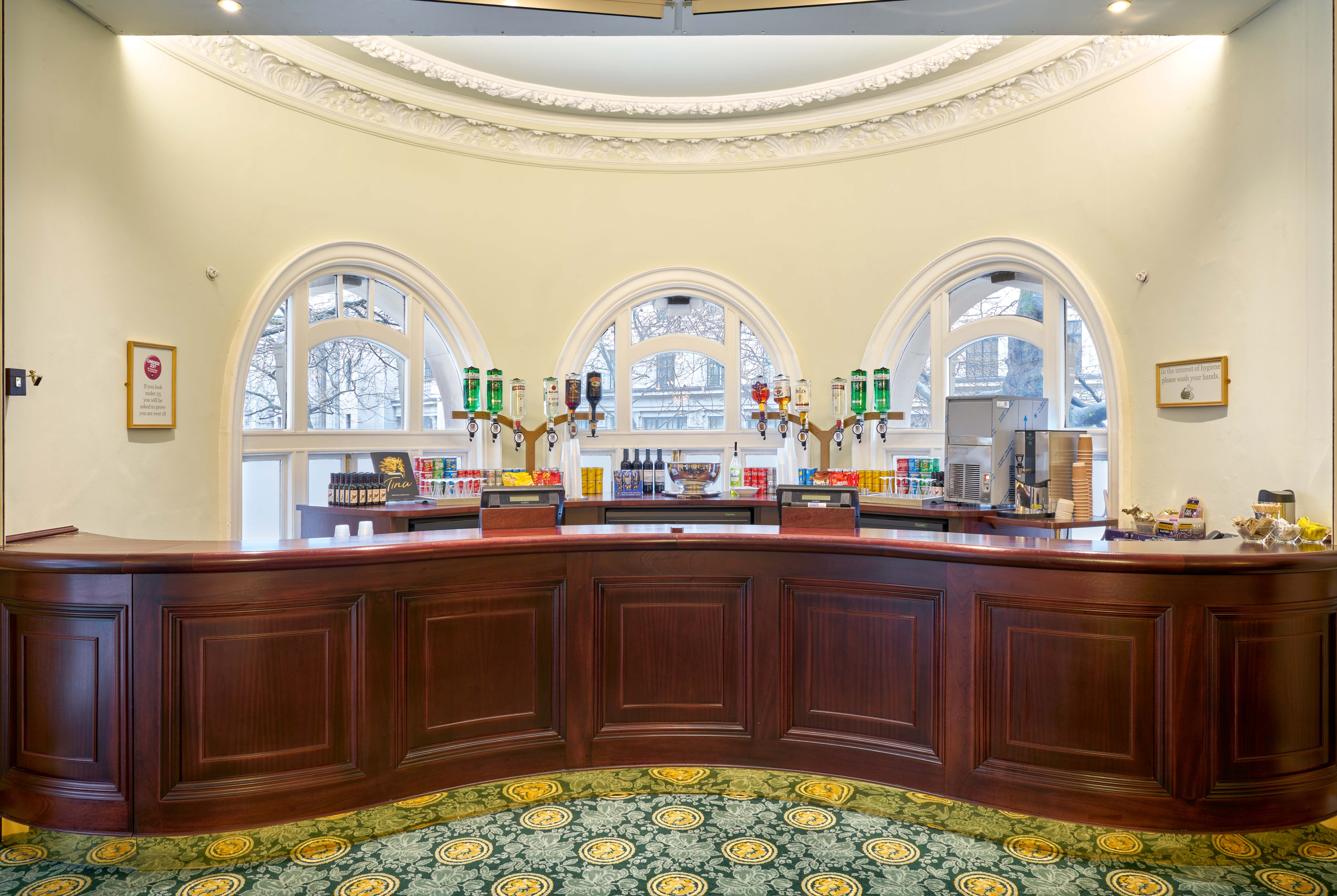 Aldwych Theatre bar area, polished wood counter, ideal for networking events and receptions.