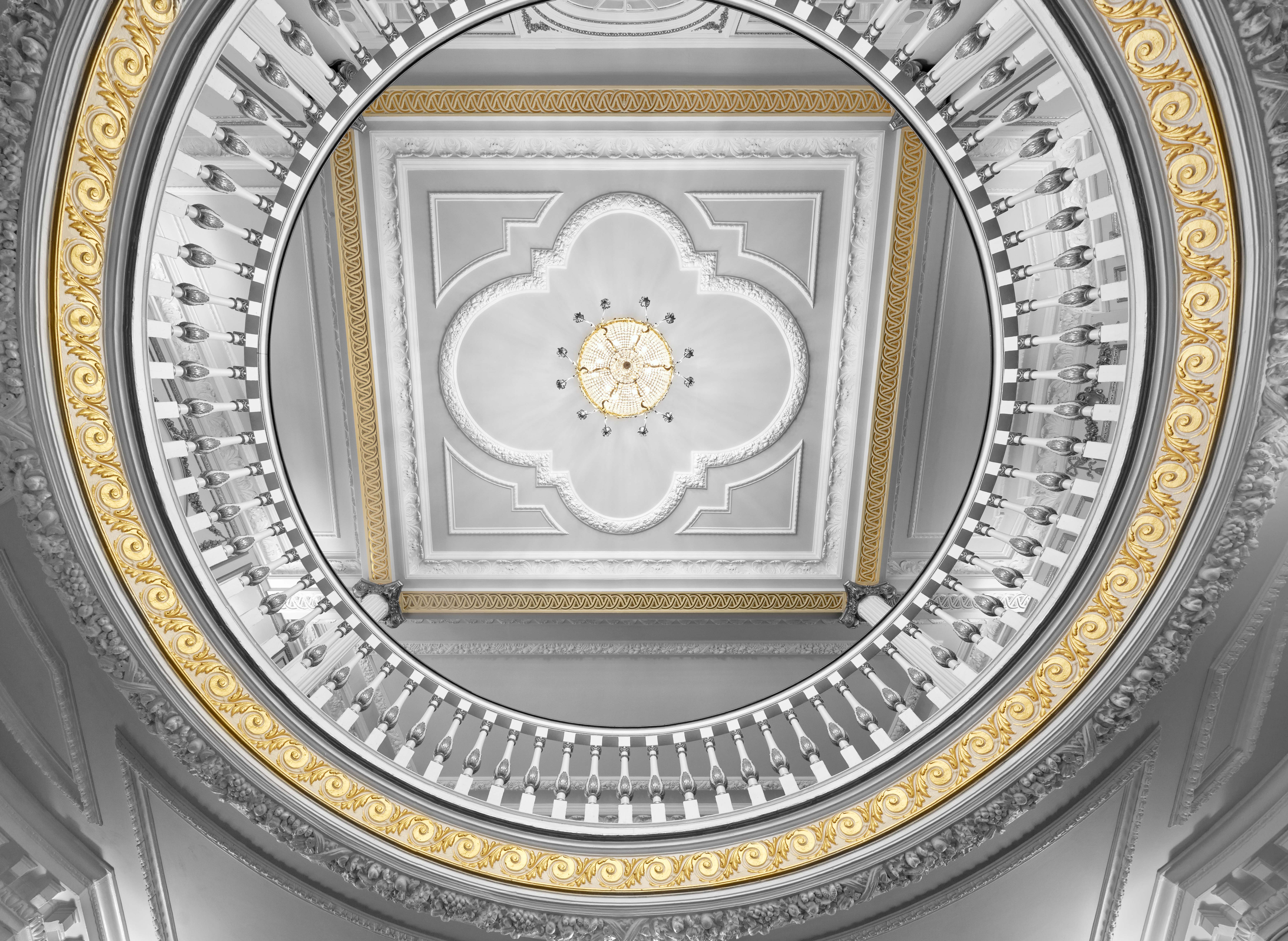 Aldwych Theatre Auditorium with elegant circular staircase, perfect for upscale events.