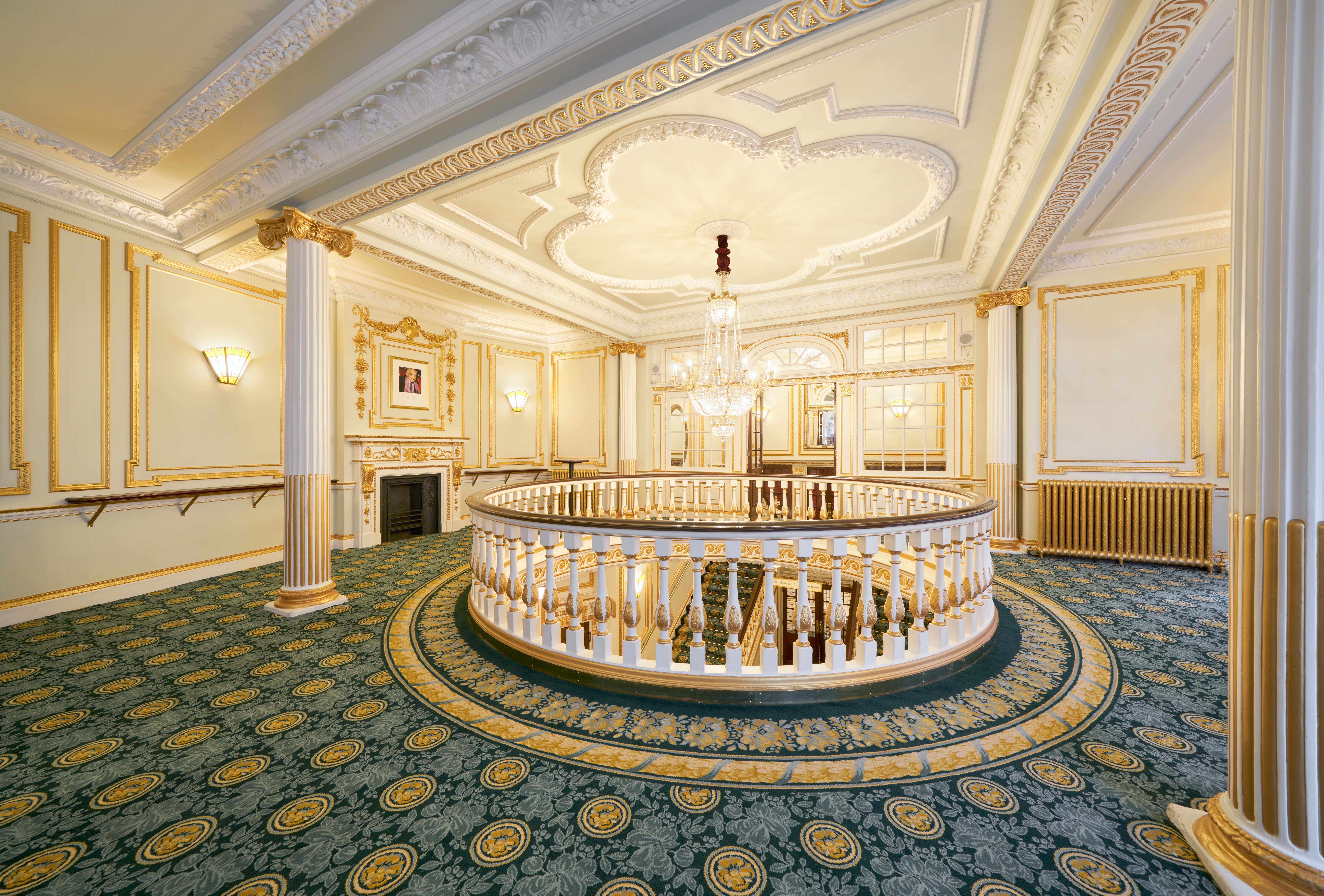 Elegant Aldwych Theatre Auditorium with grand chandelier, perfect for upscale events.
