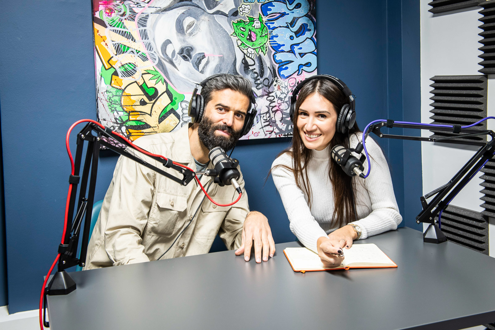Dynamic podcast recording setup with professional microphones in vibrant AW Offices.
