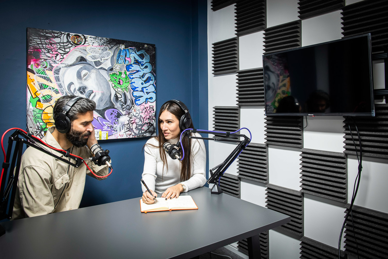 Modern podcast studio with soundproof walls for creative events and interviews.