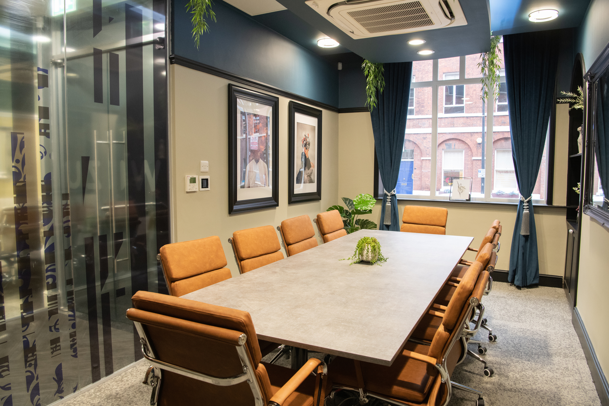 Modern meeting room in Trinity Suite, Wizu Workspace, ideal for collaboration and brainstorming.