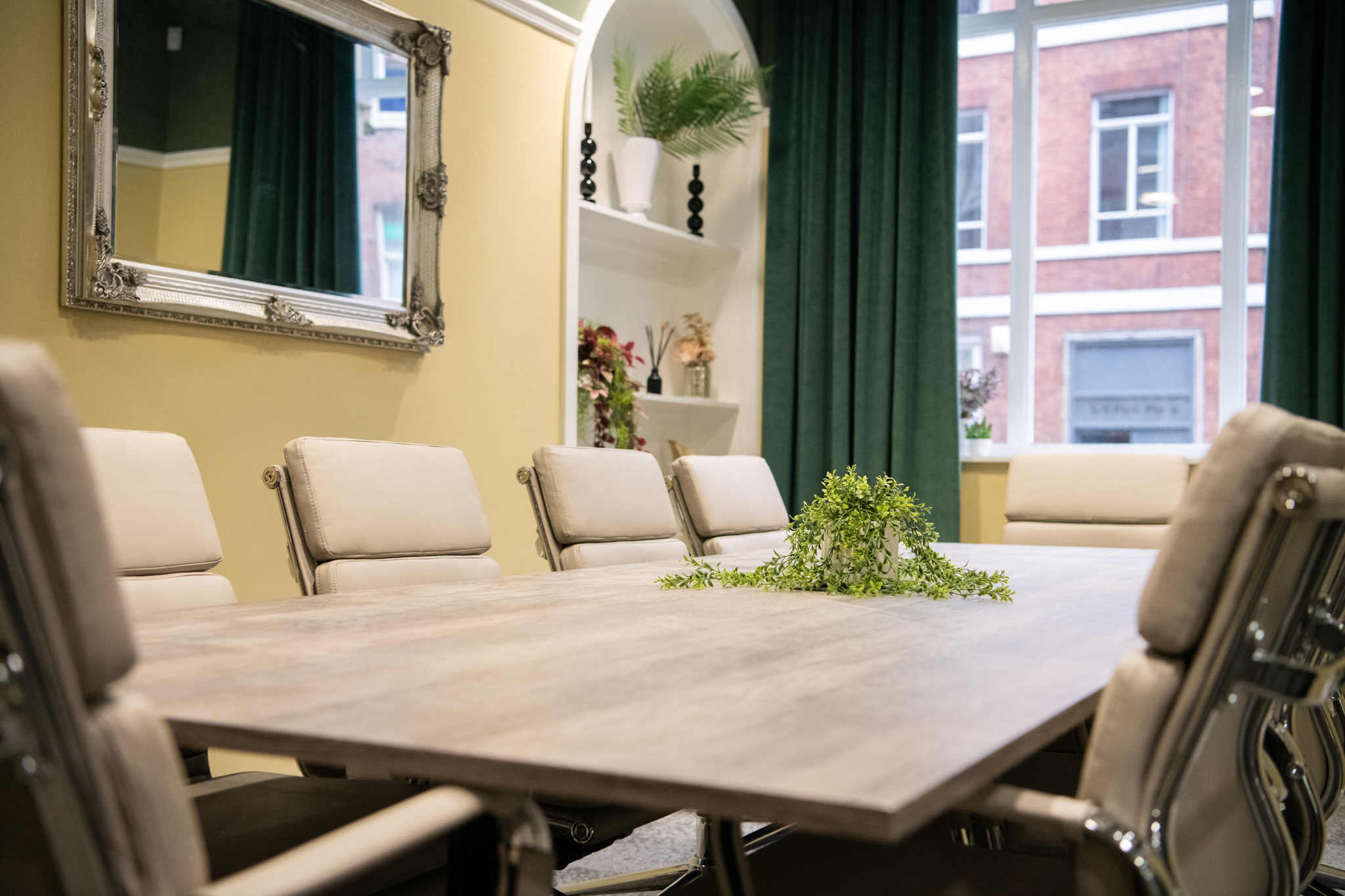 Wellington Suite meeting room with modern furnishings for workshops and executive meetings.