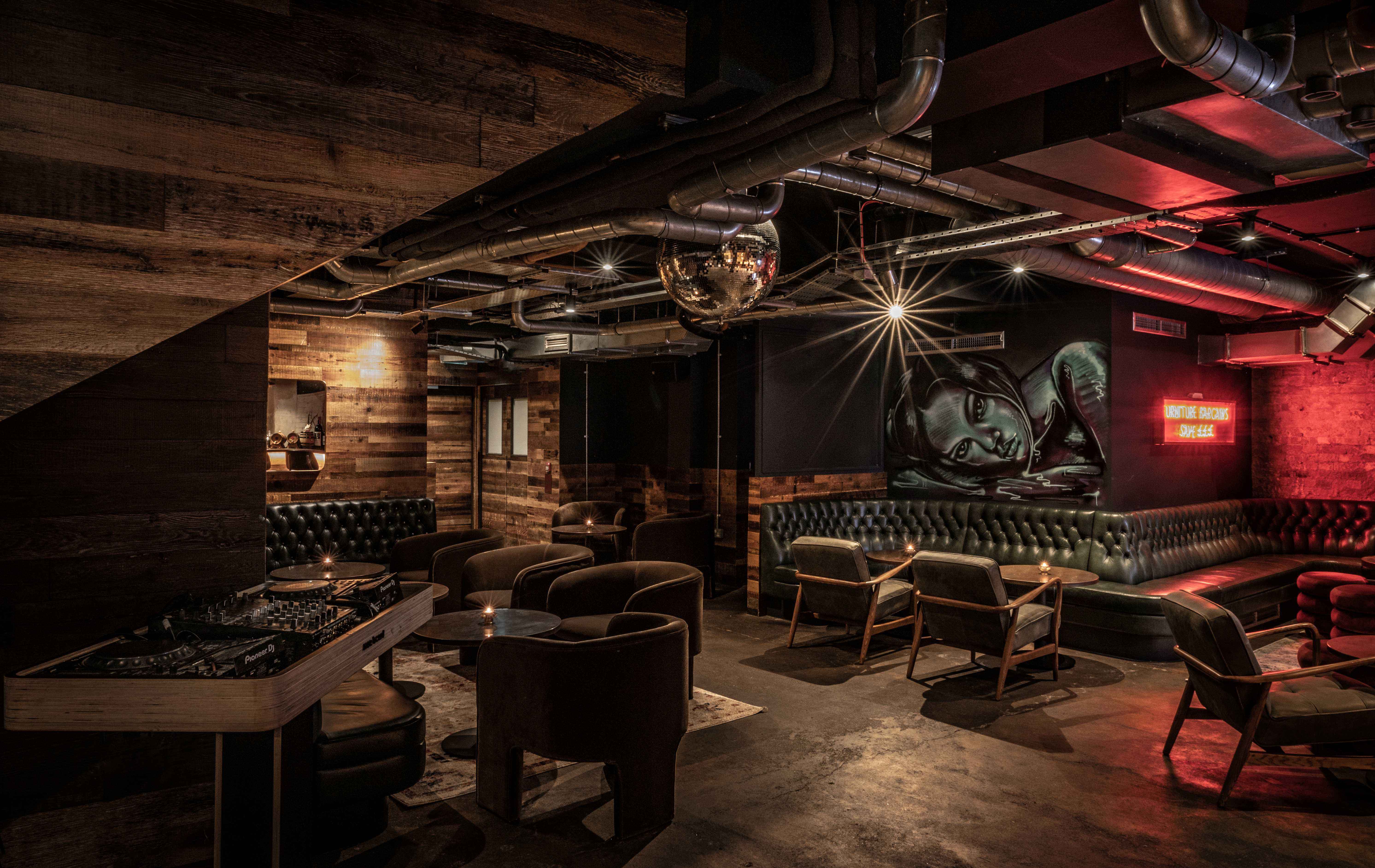 Stylish private bar with cozy seating, ideal for networking events and cocktail receptions.