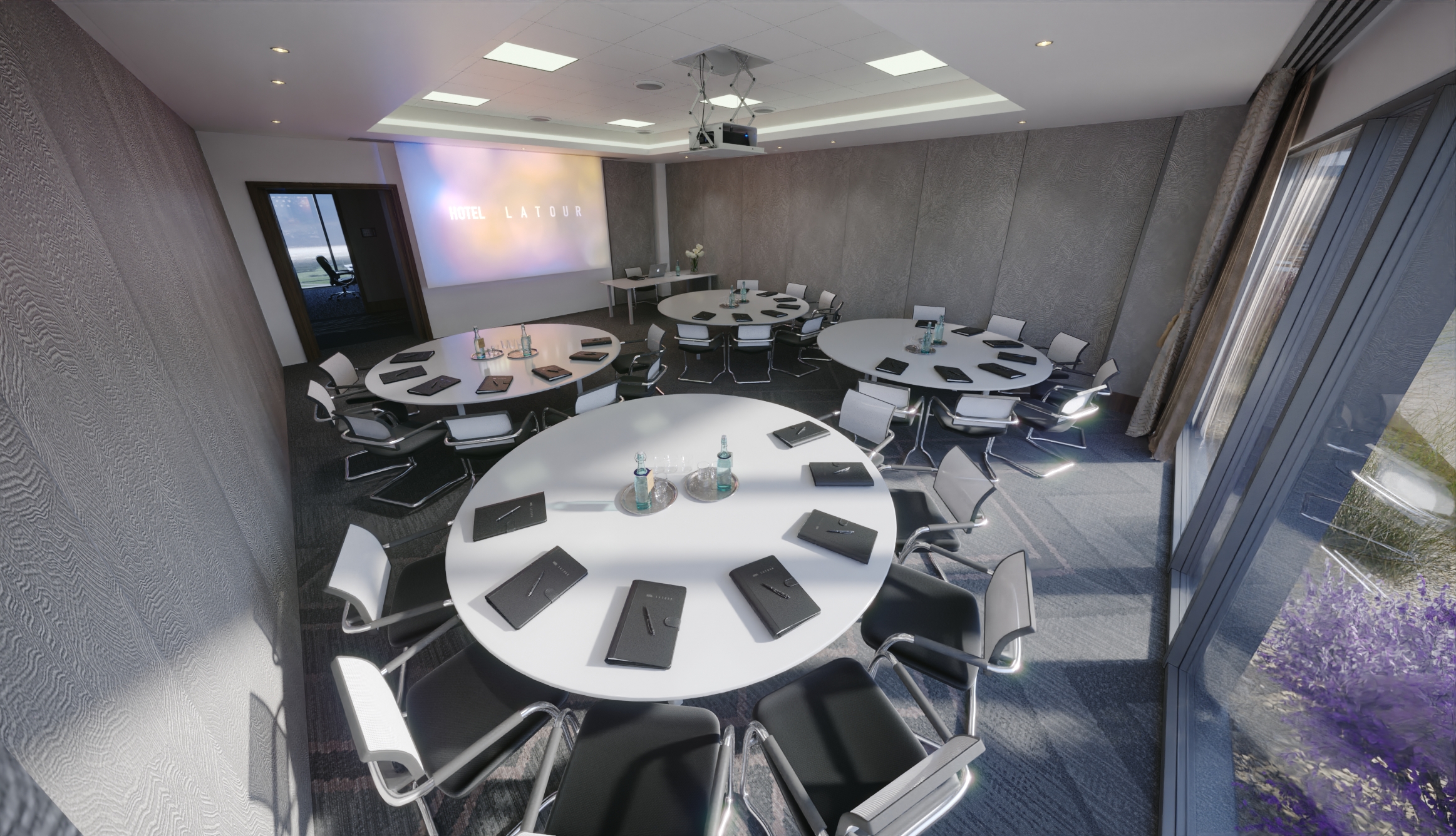 Modern meeting room with round tables and large screen at Hotel La Tour for events.
