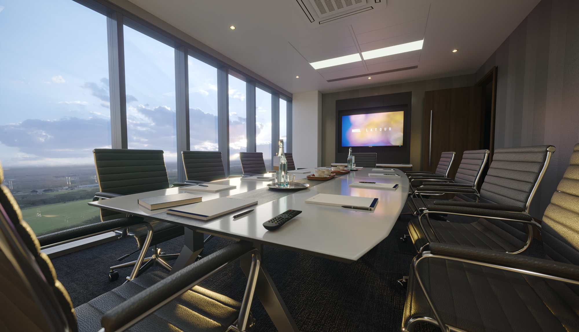 Modern conference room with large windows for meetings at Hotel La Tour.