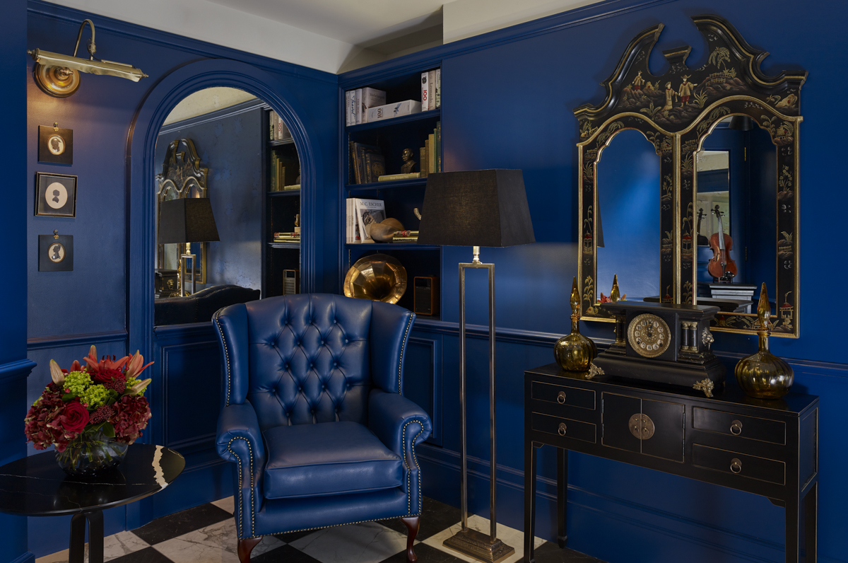 Sophisticated meeting space at Holmes Hotel London with rich blue walls, ideal for networking events.