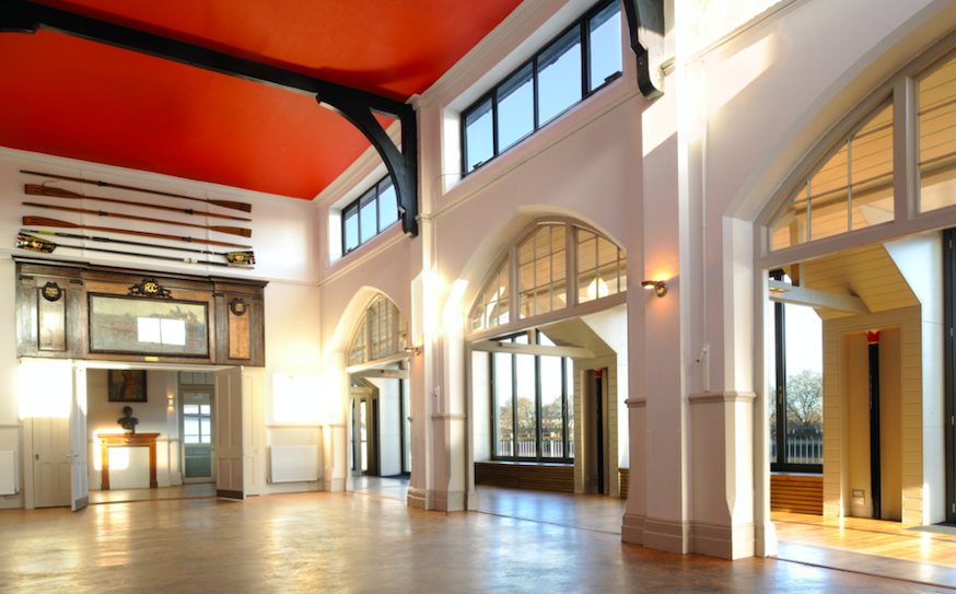 Great Hall at Thames Rowing Club, spacious venue with red ceiling for events and meetings.