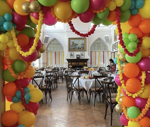Great Hall at Thames Rowing Club with colorful balloon decor for festive events.
