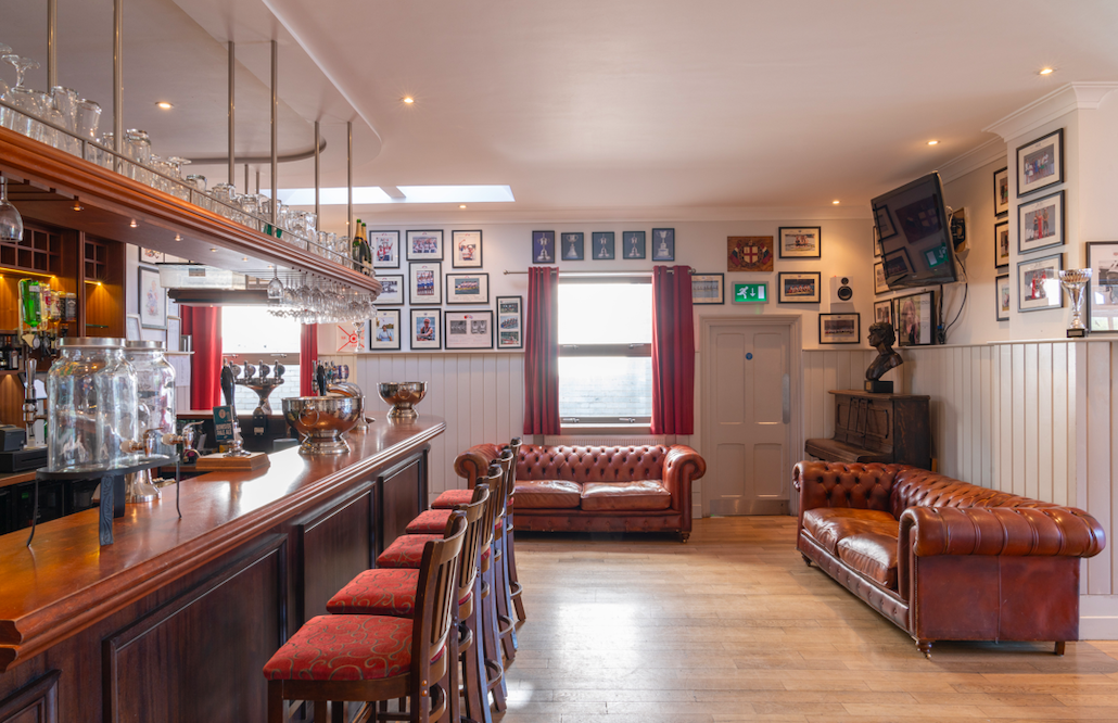 Great Hall at Thames Rowing Club, polished bar, ideal for networking events and gatherings.
