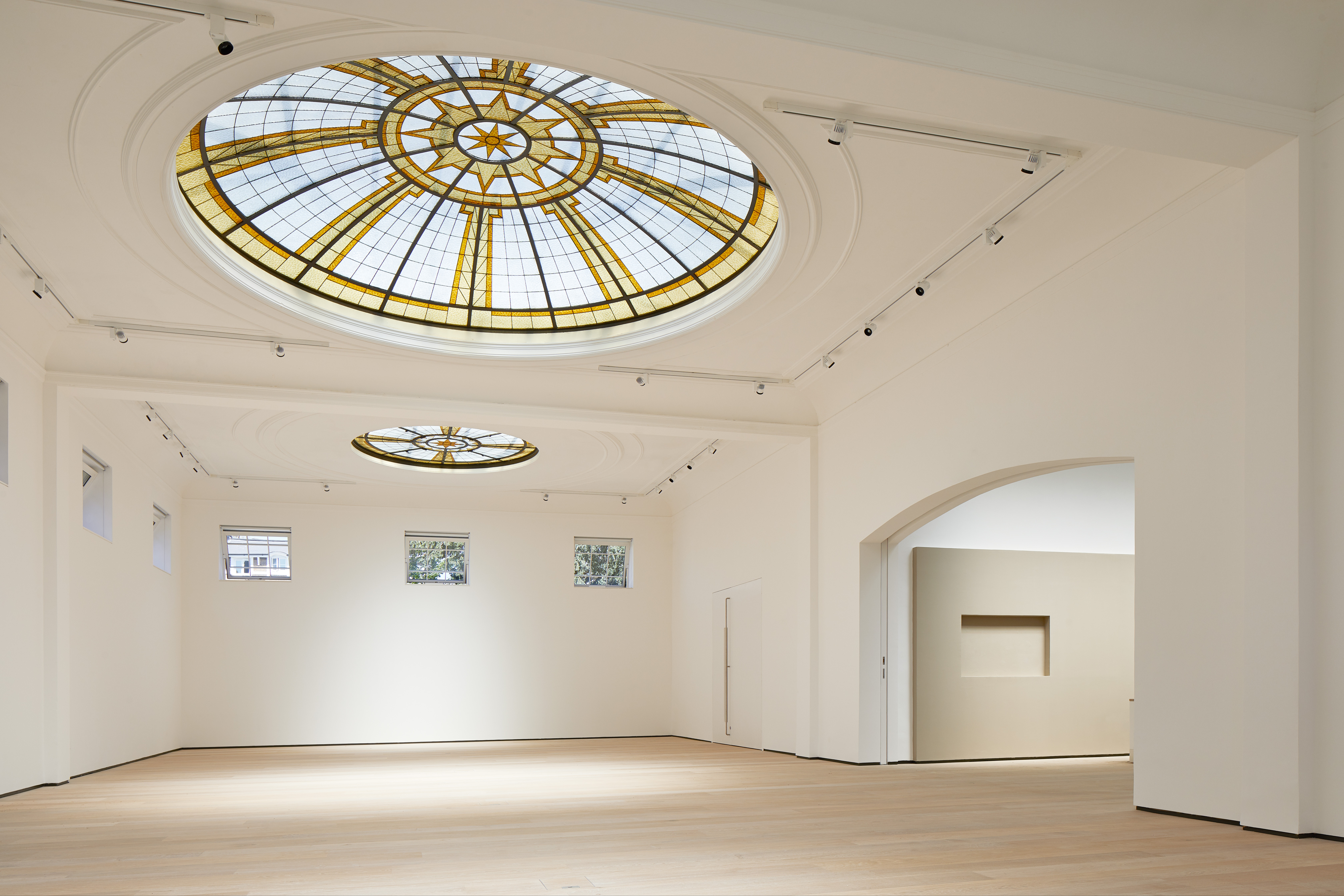 Spacious Pitzhanger Manor gallery with stained glass ceiling for events and exhibitions.