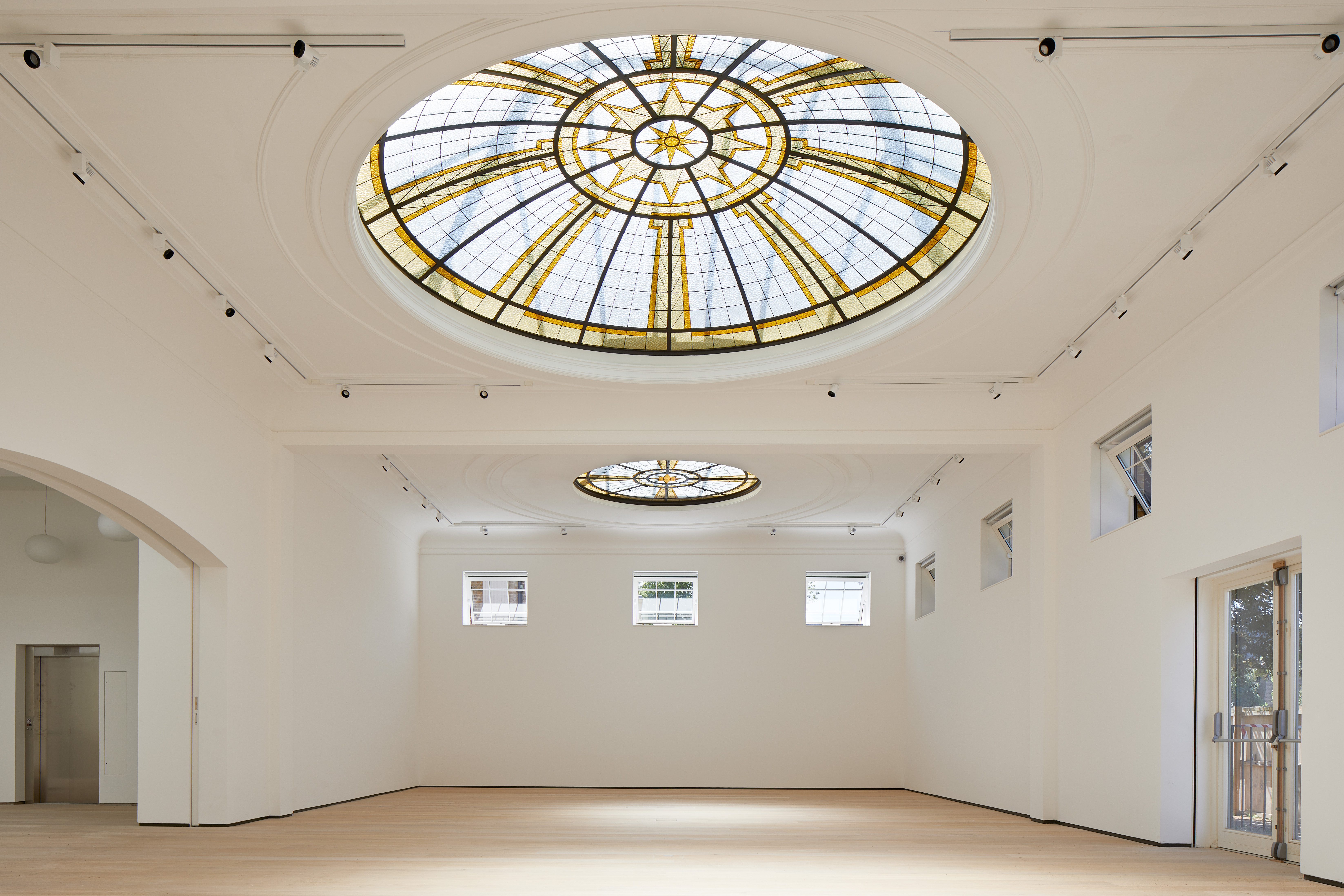 Elegant event space with stained glass ceiling at Pitzhanger Manor & Gallery.