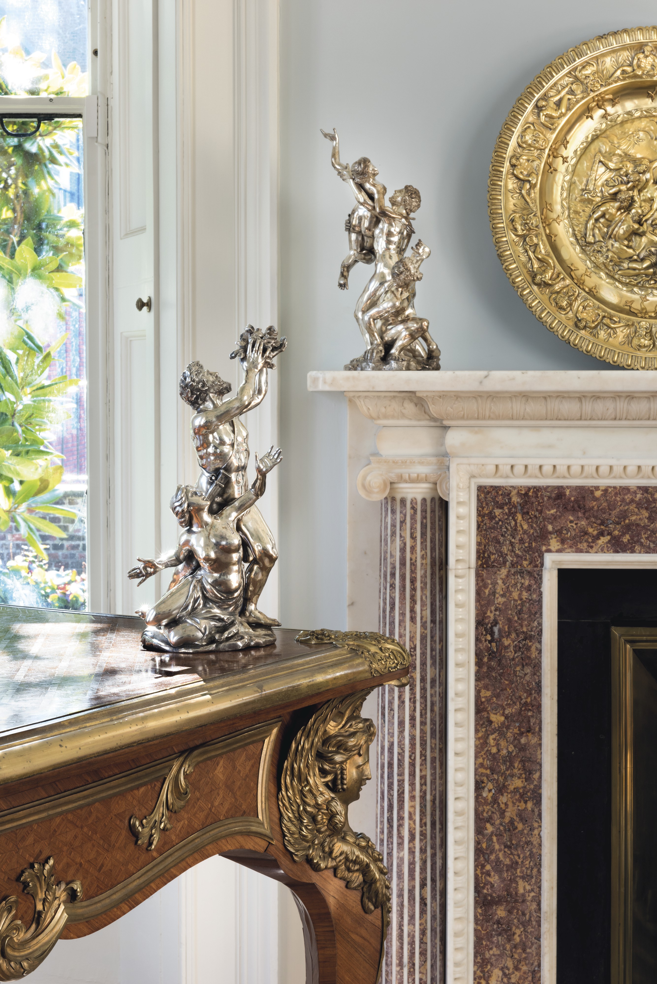 Elegant Georgian Eating Room with striking sculpture for upscale events and gatherings.