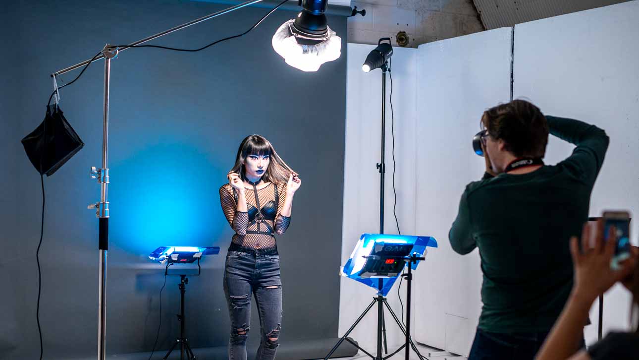 Dynamic fashion photoshoot setup at Arch Photo Studio with professional lighting.