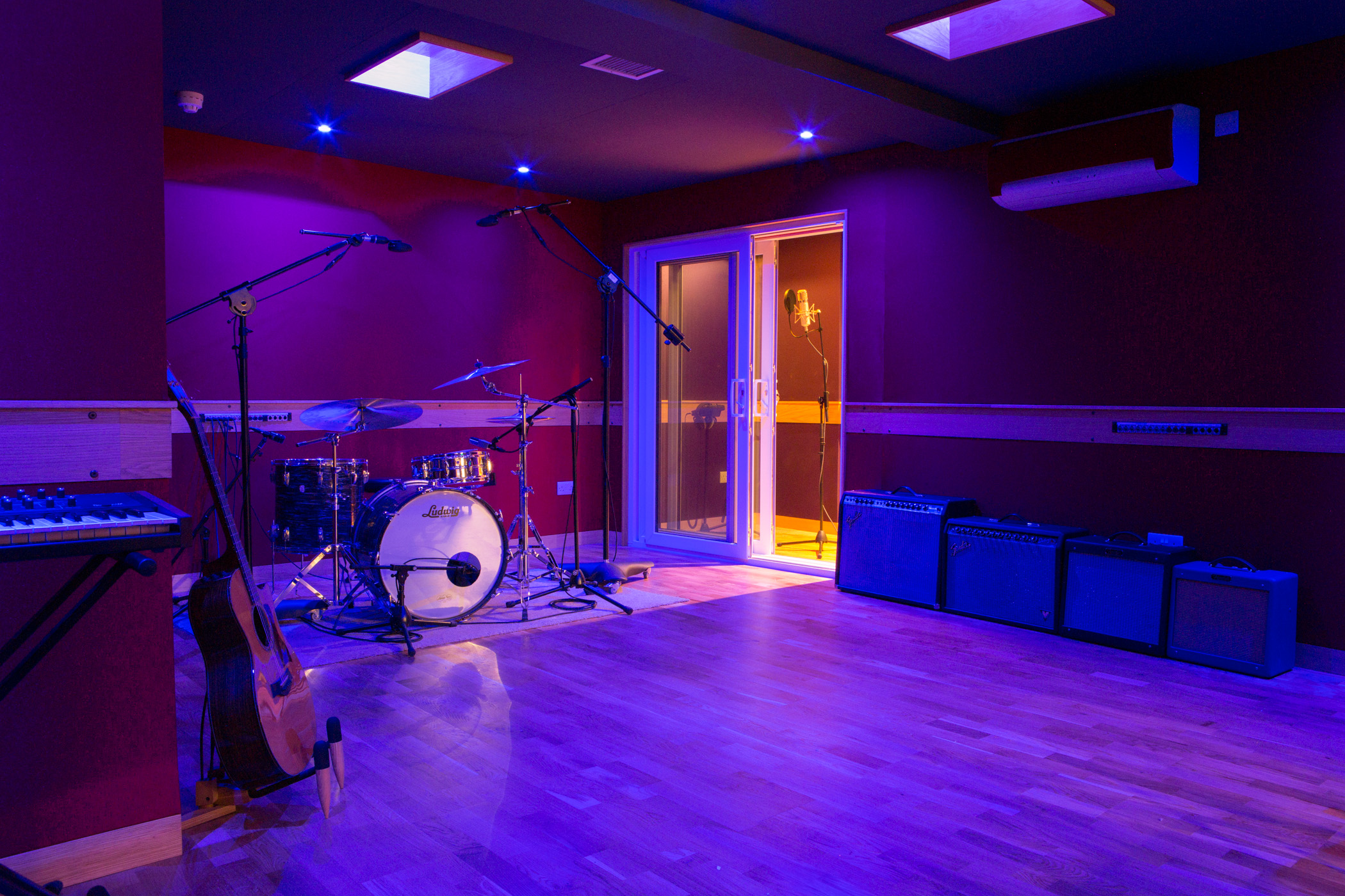 Vibrant Dock Street Studio venue with stage, ideal for music events and workshops.
