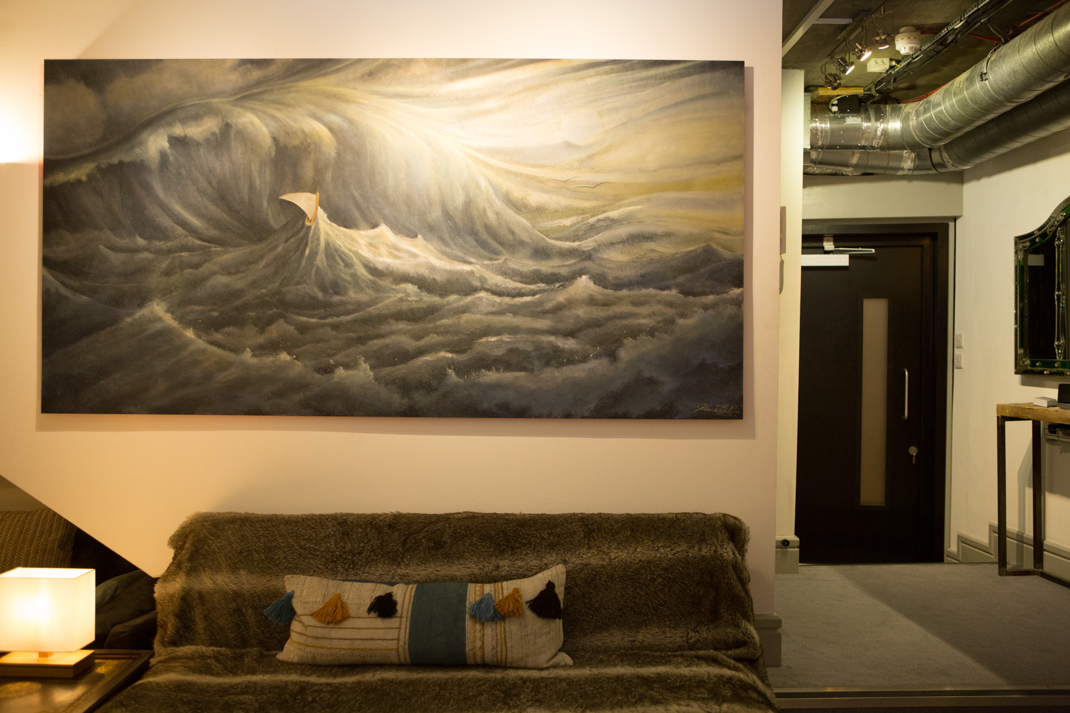 Large-scale wave painting in Dock Street Studio, ideal for networking events.