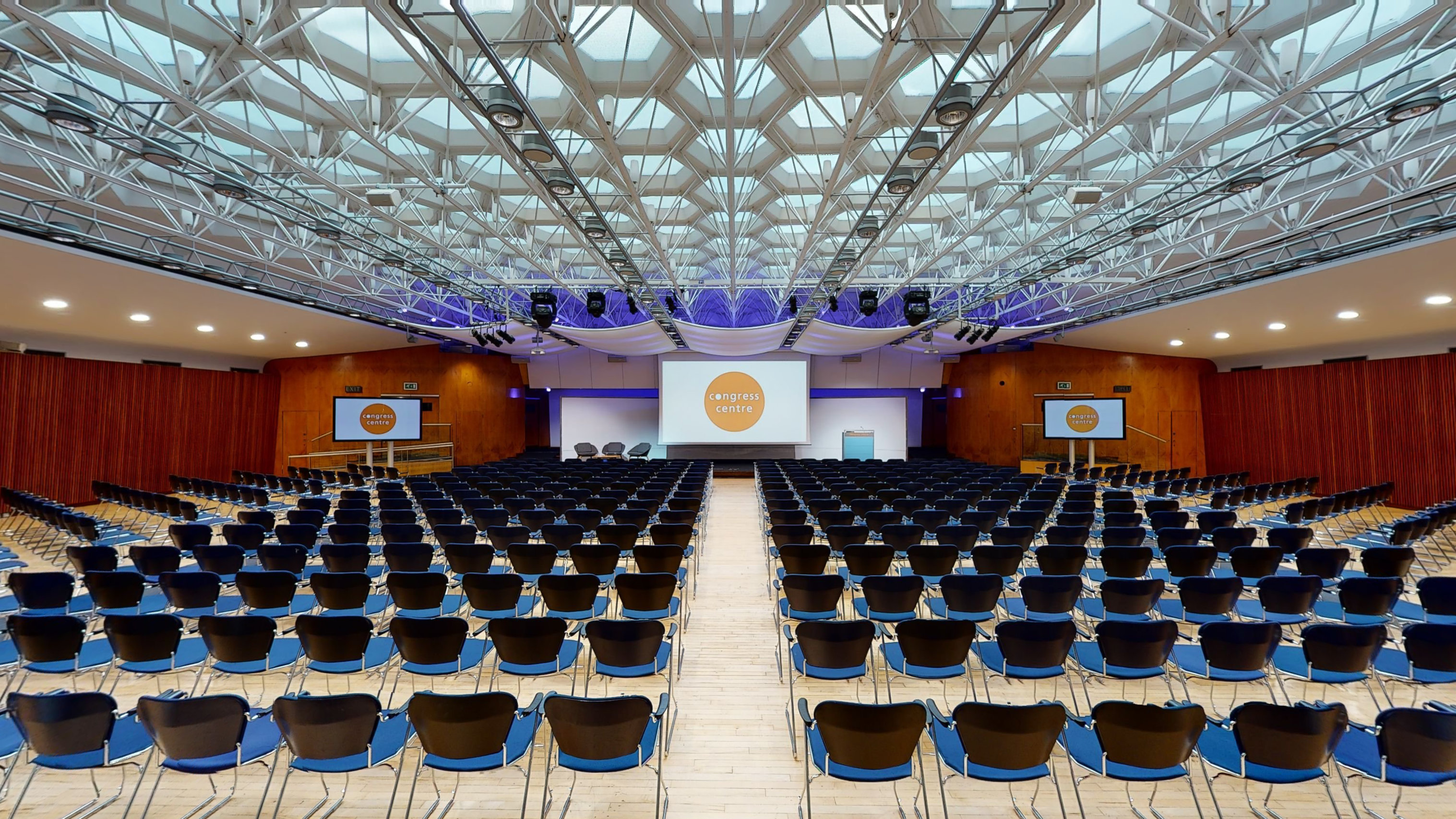 Congress Hall theater setup with architectural ceiling for large-scale keynotes and plenary sessions.