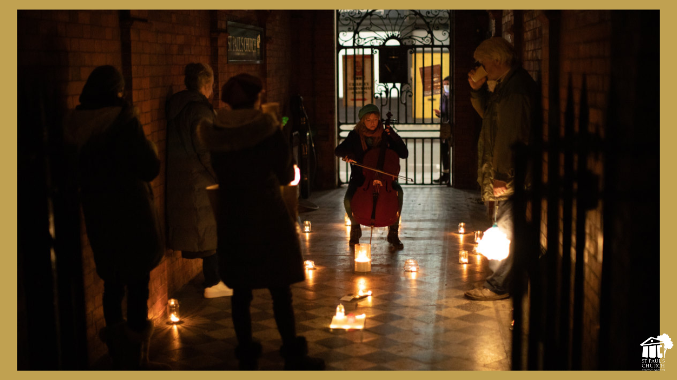 Cellist performing in softly lit St Paul's Church, Covent Garden for an intimate event.