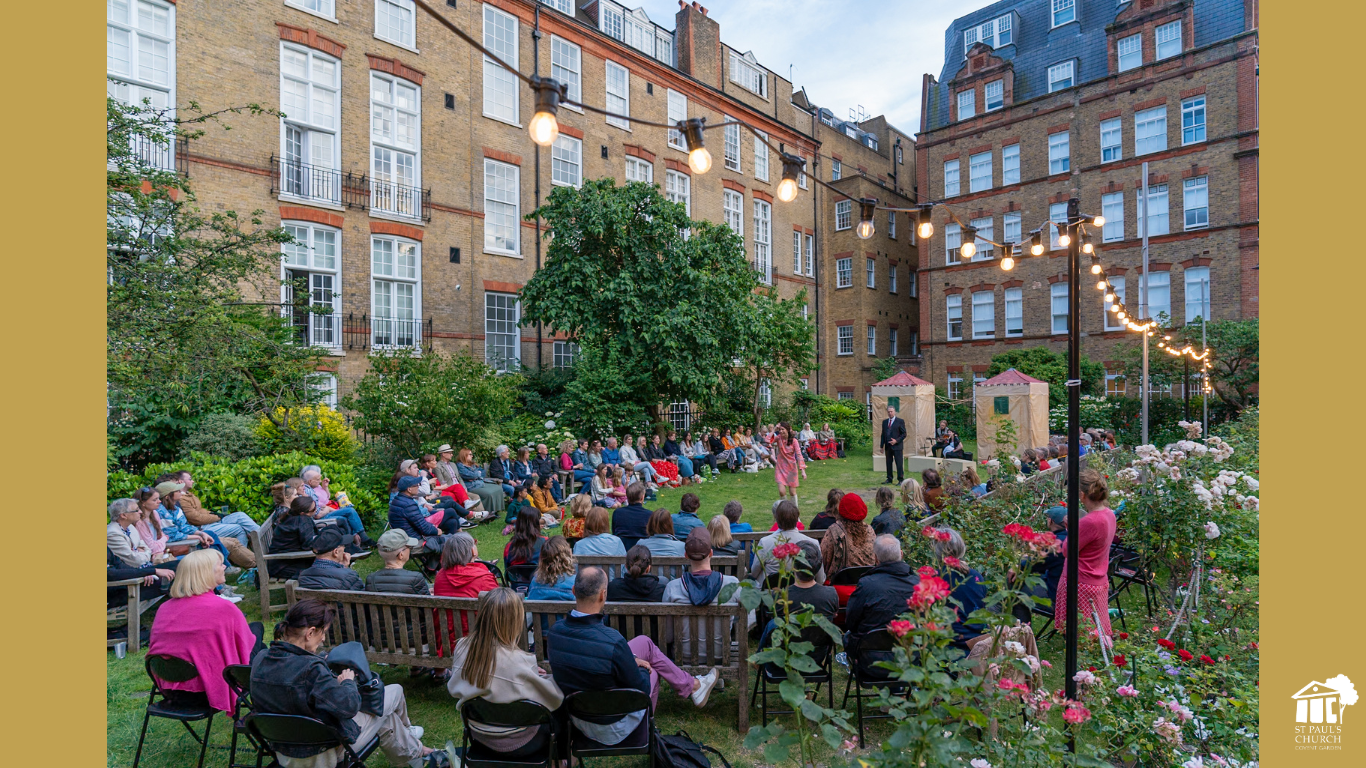 Outdoor event at St Paul's Church Covent Garden with lush greenery and stage setup.