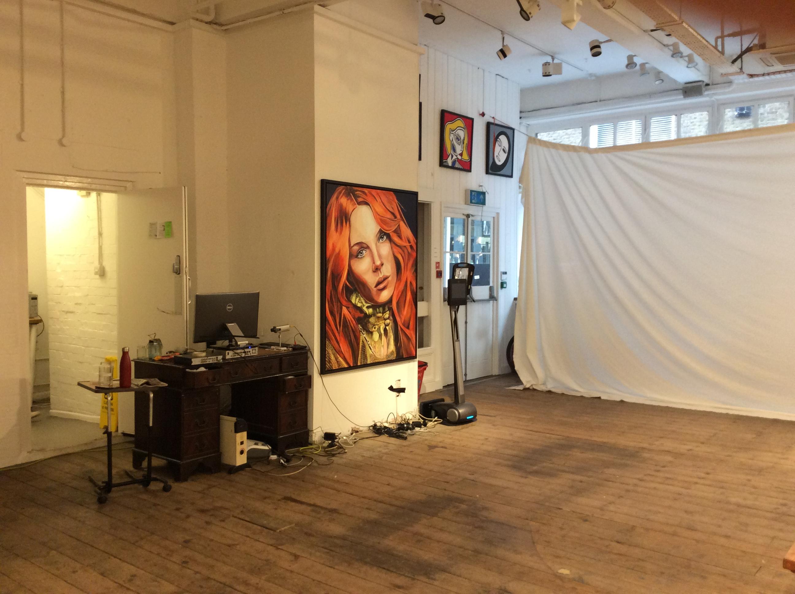 Versatile event space with striking artwork, ideal for meetings and workshops.