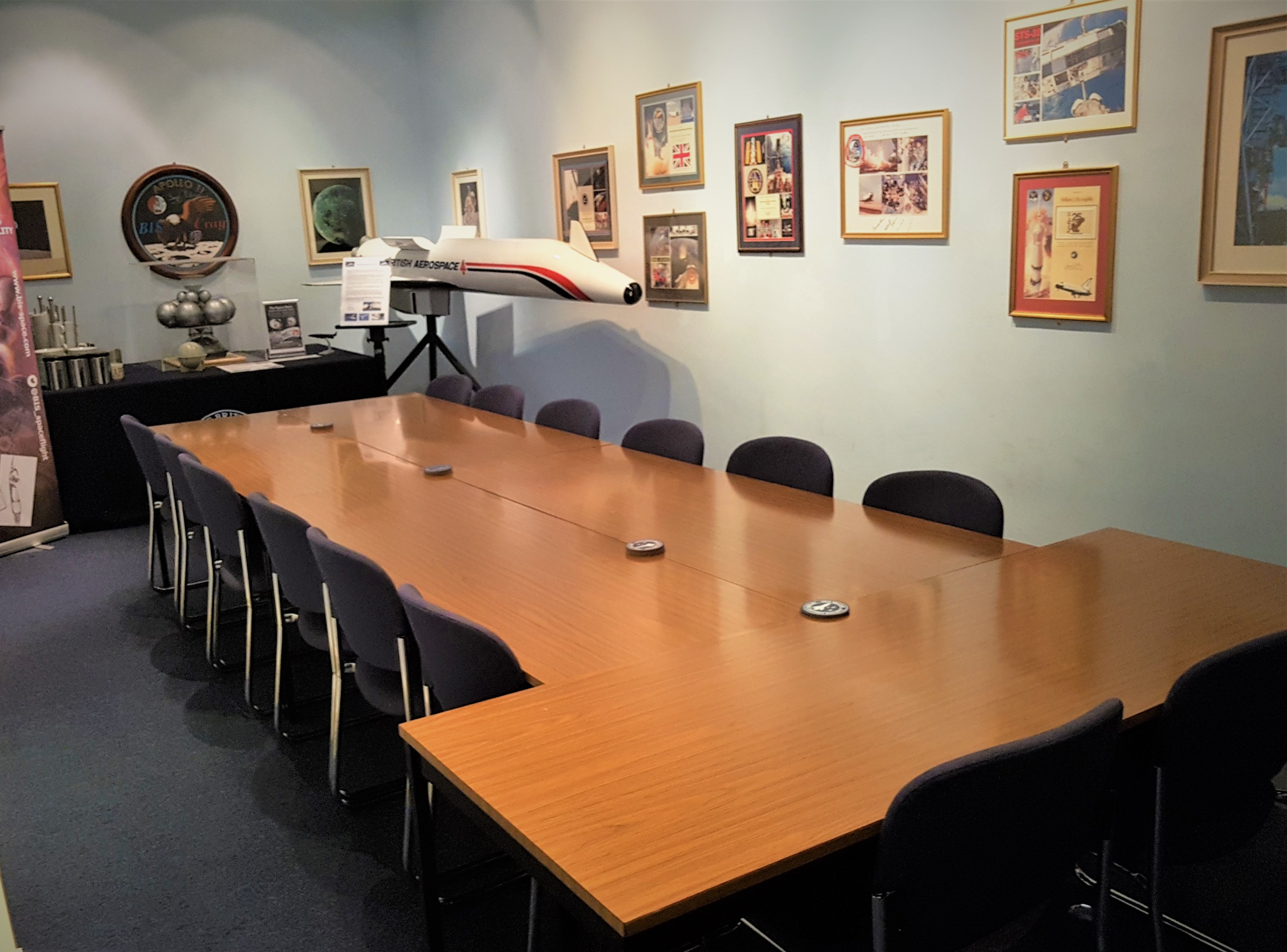 Golovine Lecture Hall with wooden table, ideal for meetings and presentations.