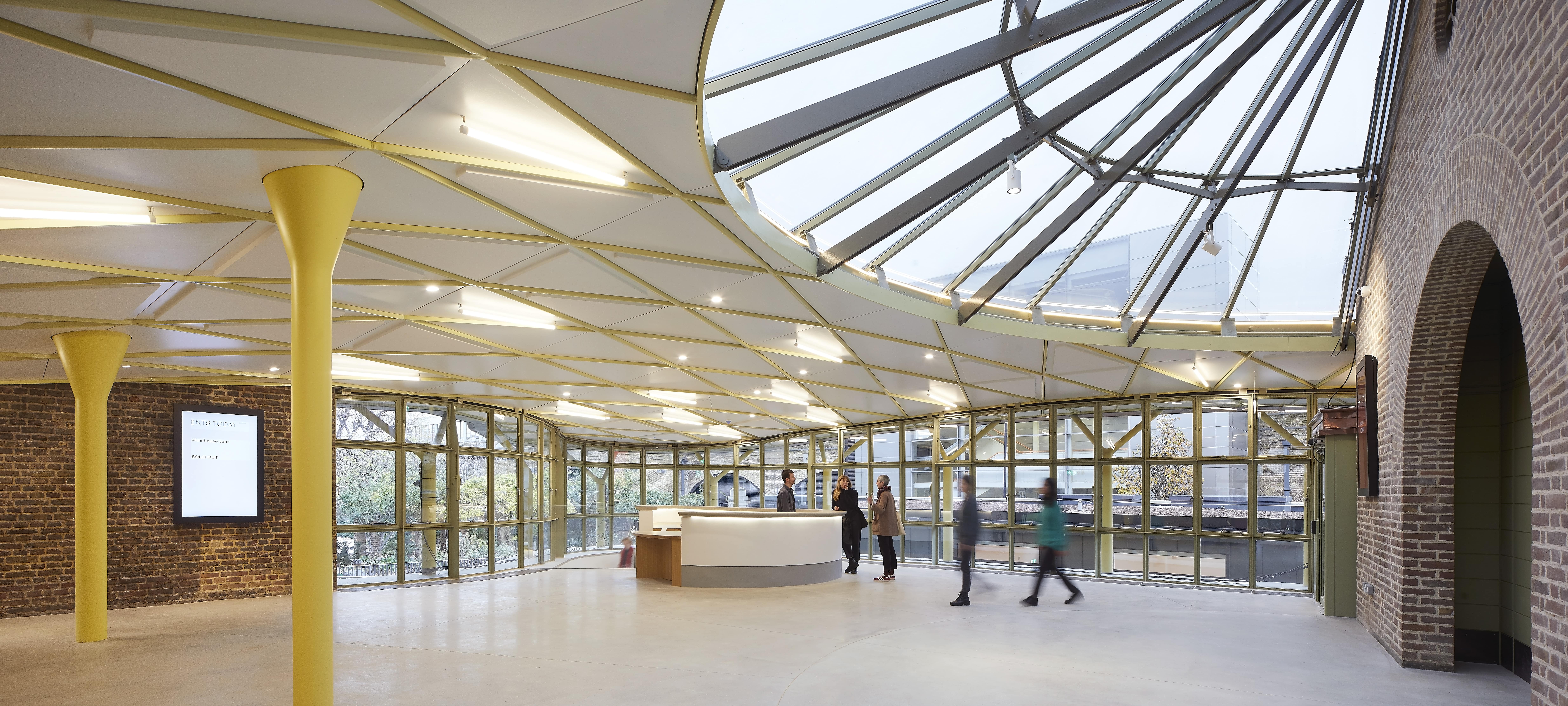 Modern event space with glass roof in Shoreditch Gardens, ideal for meetings and networking.
