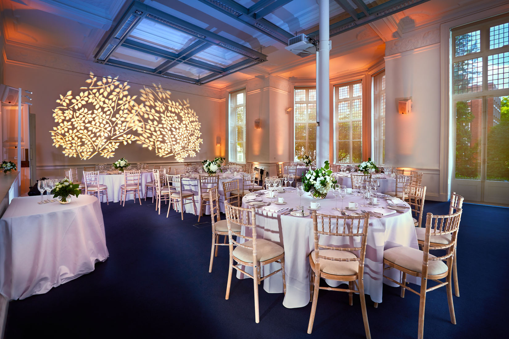 Main Hall & Education Centre with elegant round tables, ideal for weddings and upscale events.