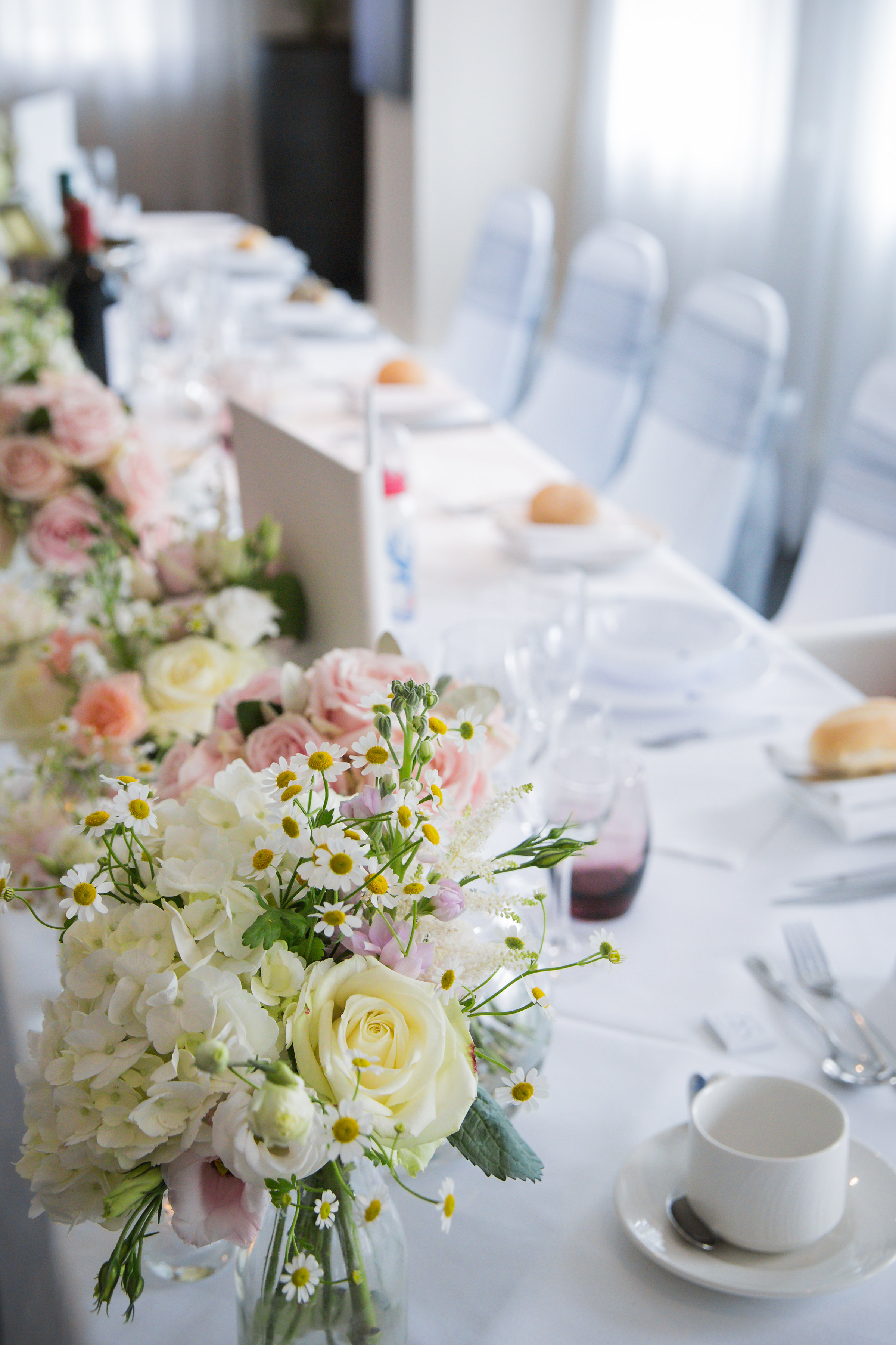 Elegant table setting with floral centerpieces at Speroni's Restaurant, Crystal Palace.