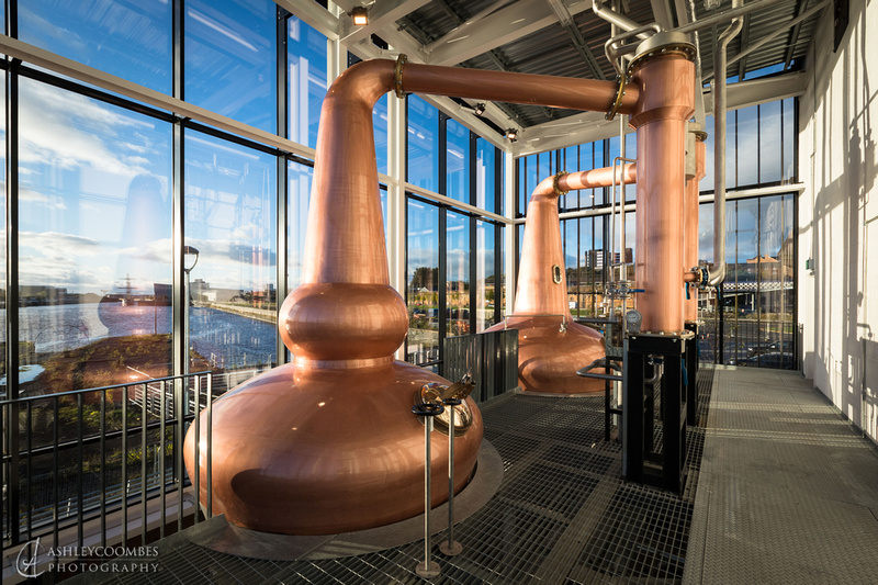 Modern distillery venue with copper stills for corporate events and private gatherings.