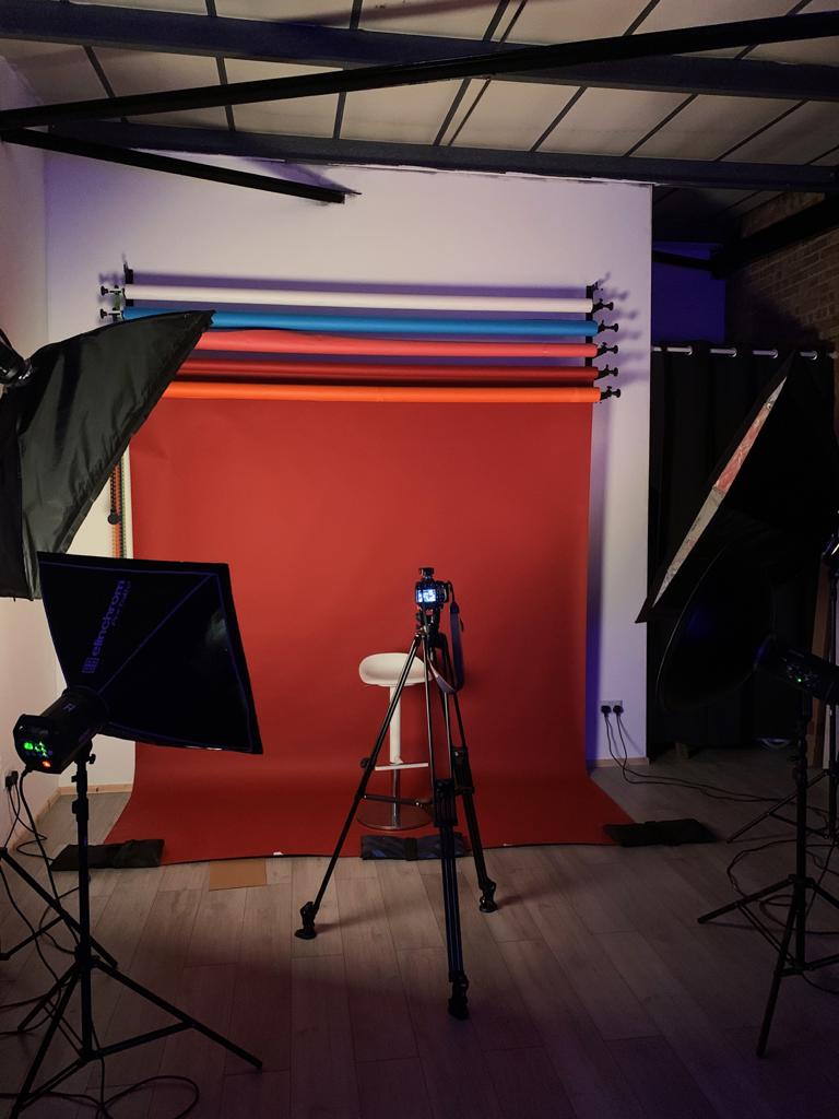 Professional photography setup with vibrant backdrop for corporate events and workshops.