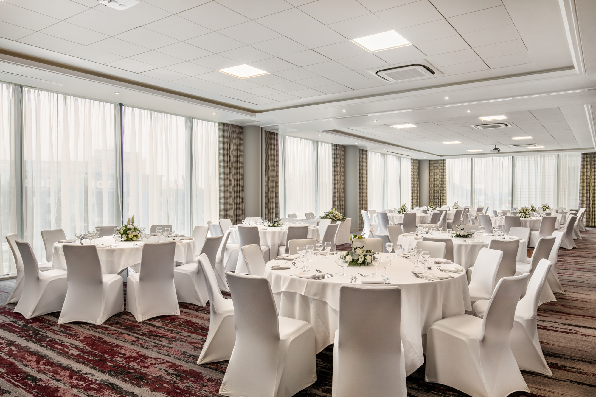 Docklands Suite at Crowne Plaza London, elegant event space with natural light.