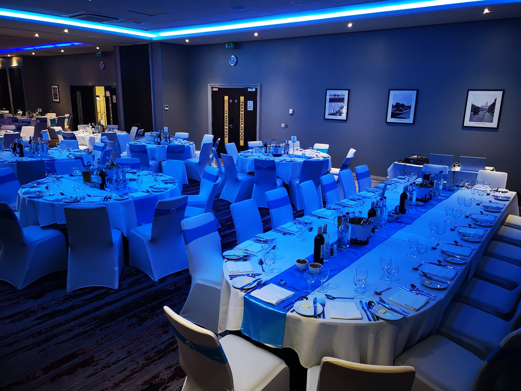 Elegant Docklands Suite with blue lighting, ideal for formal events and celebrations.