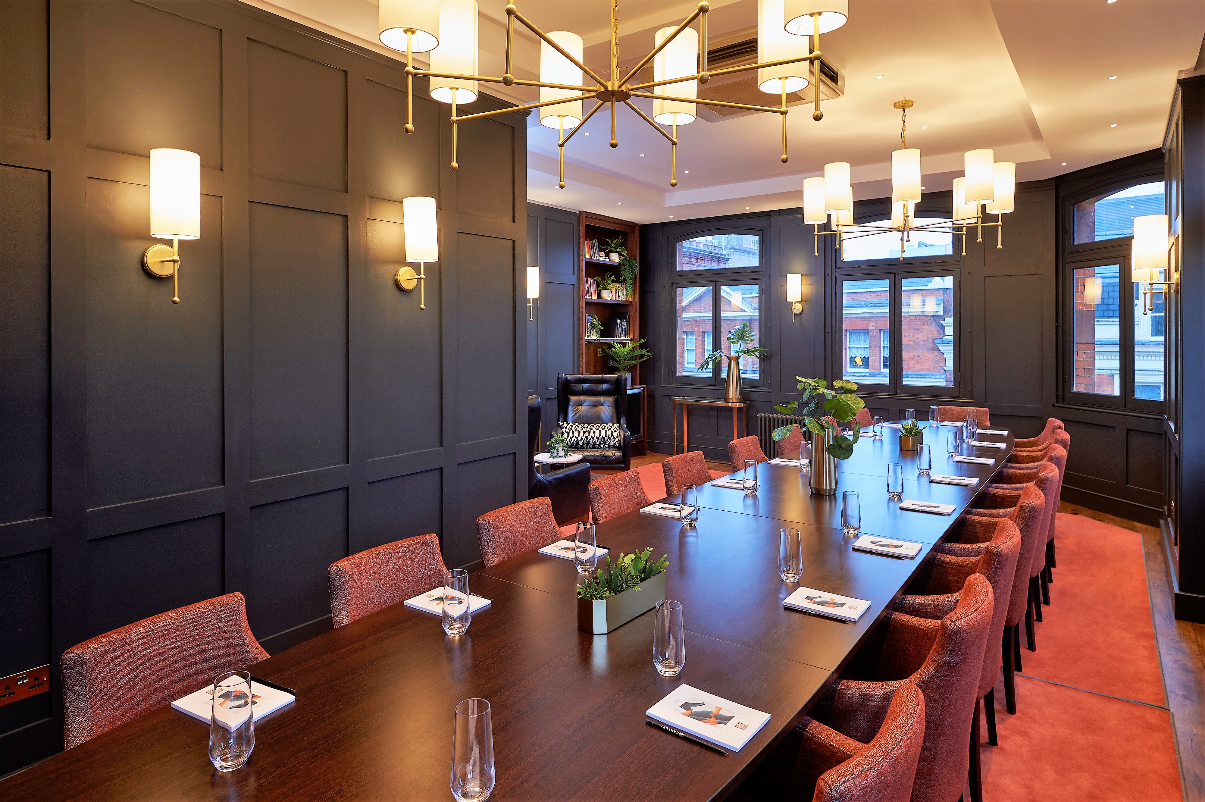 Sophisticated meeting room at The Wardour, featuring dark wood paneling for events.