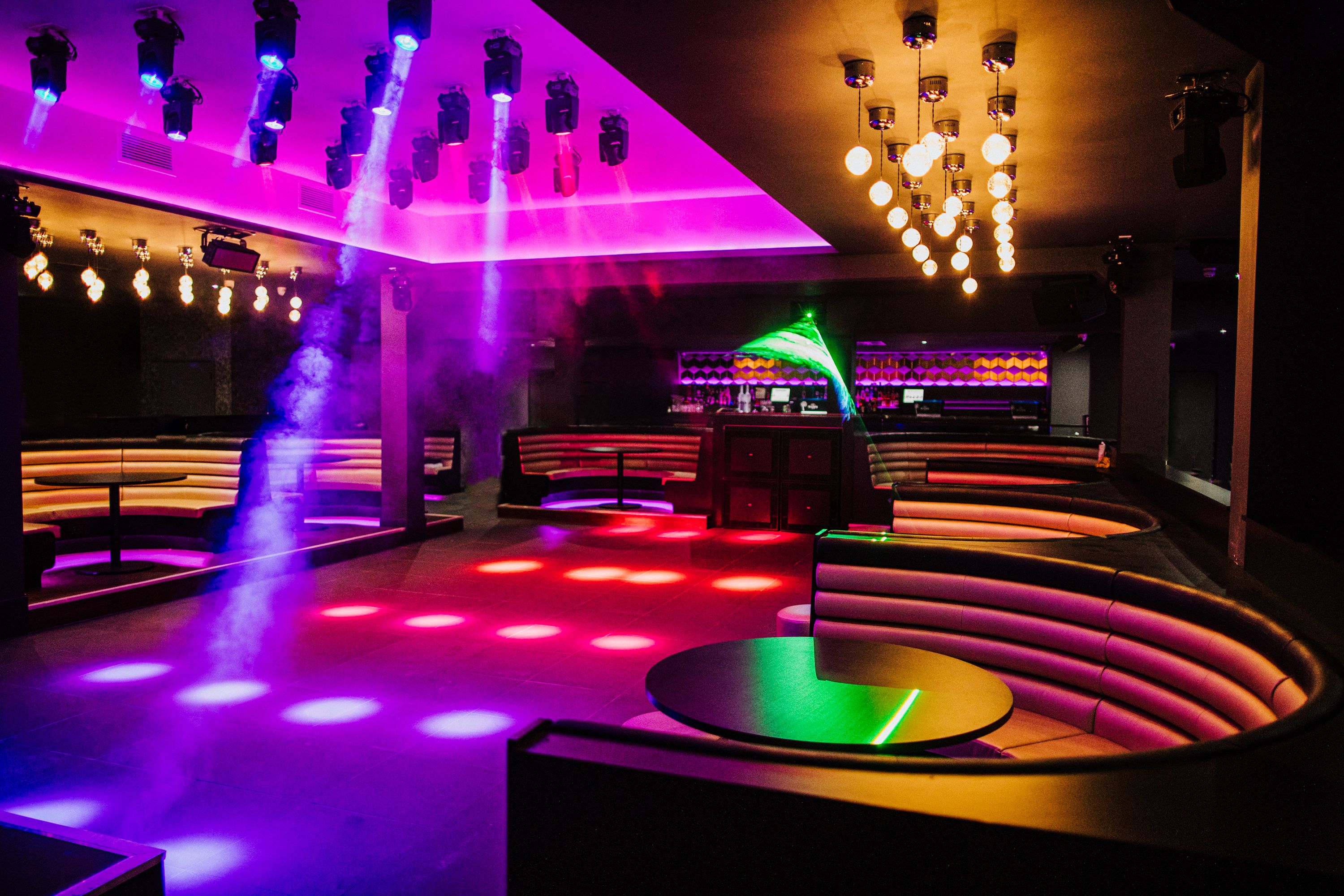 Vibrant event space with colorful lighting for parties and corporate gatherings.
