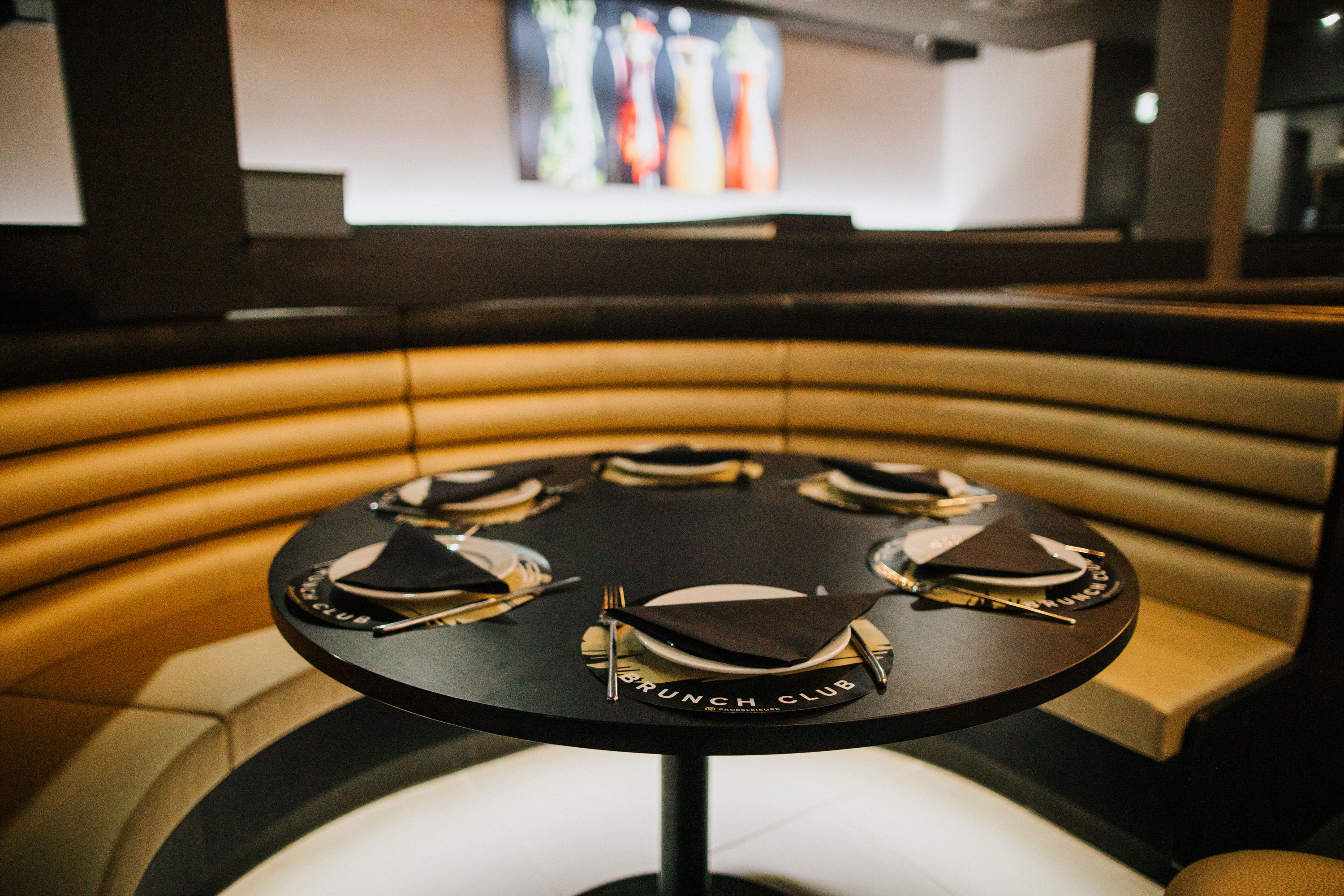 Intimate circular dining setup at Faces in Faces Leisure for small group events.