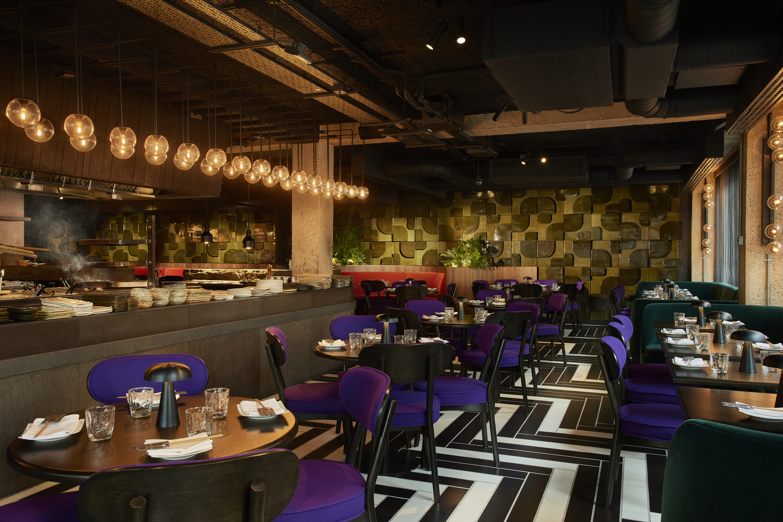 Modern dining room at Chotto Matte with purple chairs, perfect for events and gatherings.