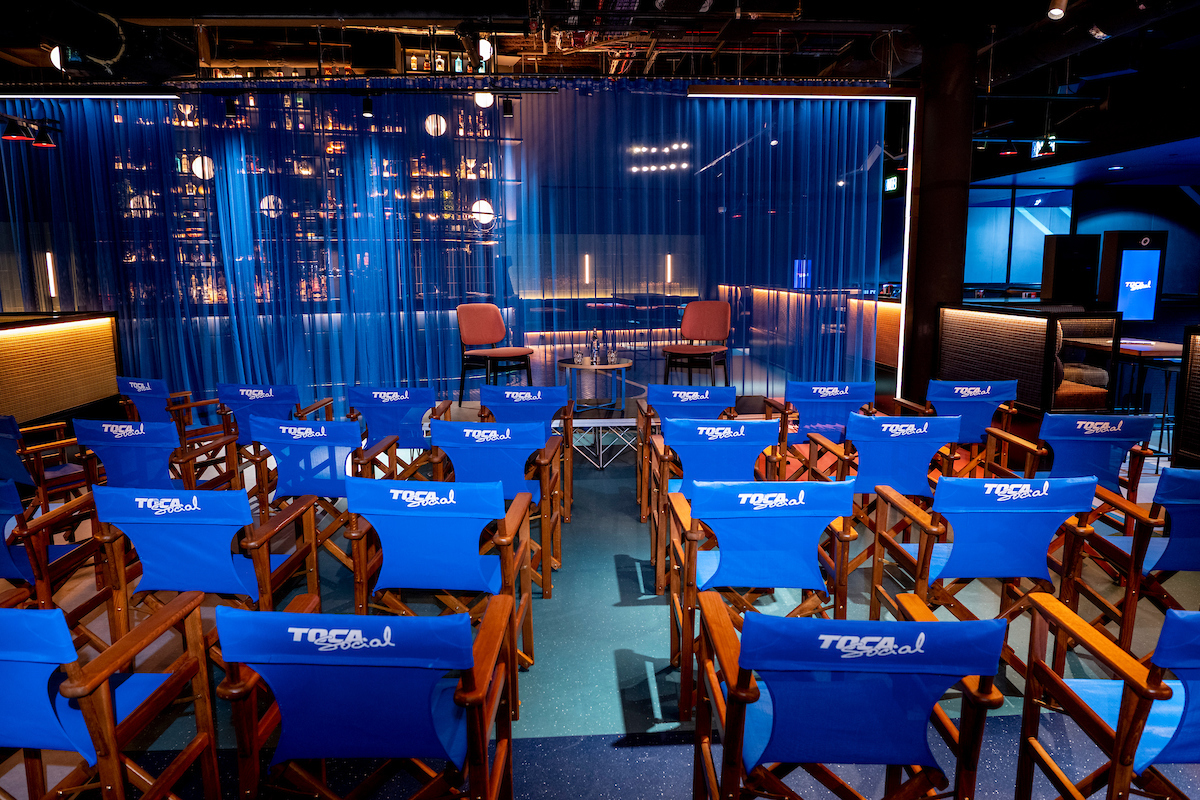 "TOCA Social event space with director's chairs, ideal for presentations and discussions."