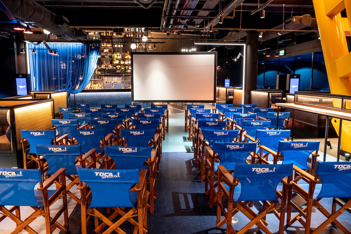 Event space with blue chairs for presentations at TOCA Social Venue Hire.