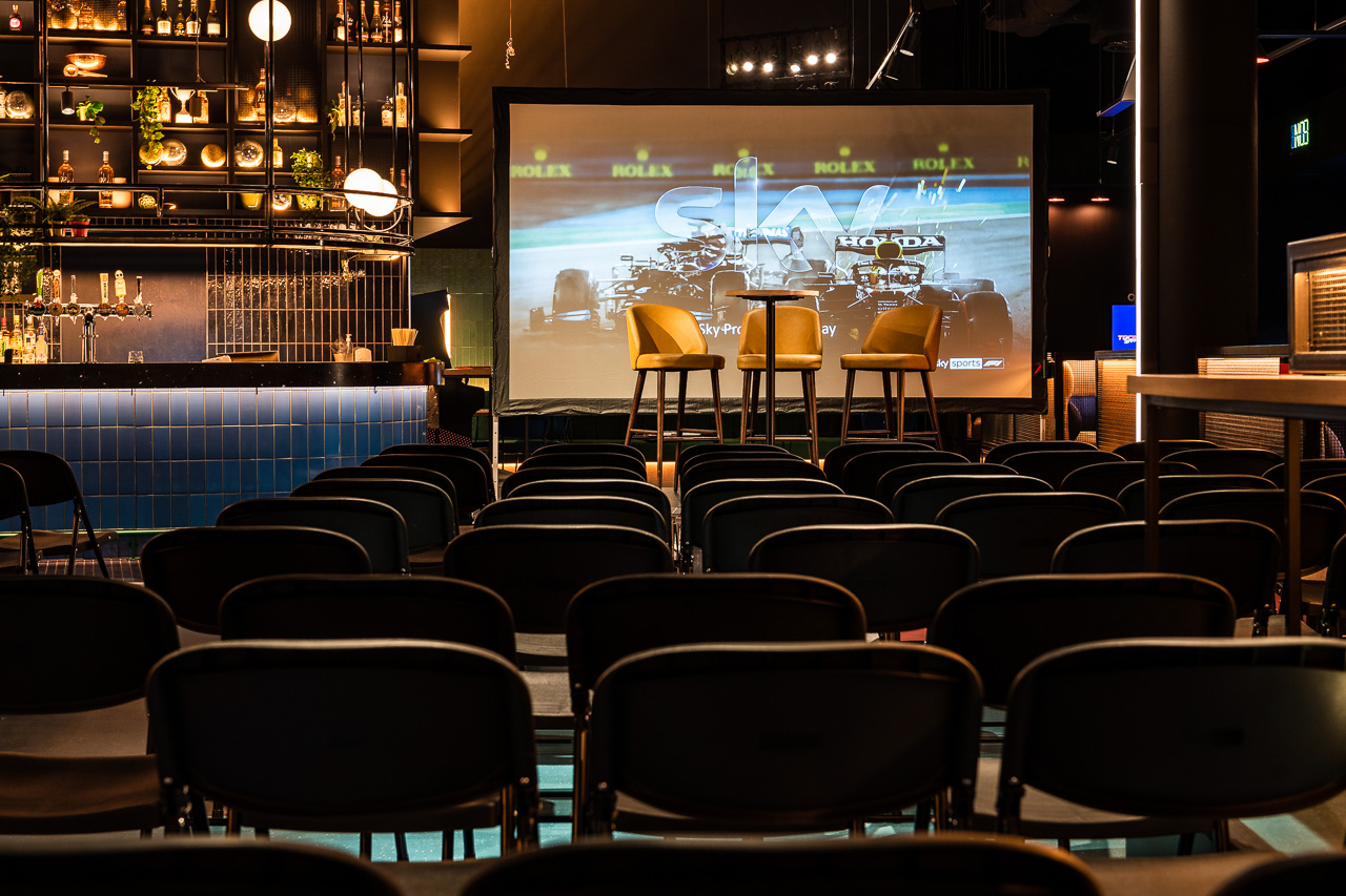 Corner Bar at TOCA Social, modern event space for presentations and panel discussions.
