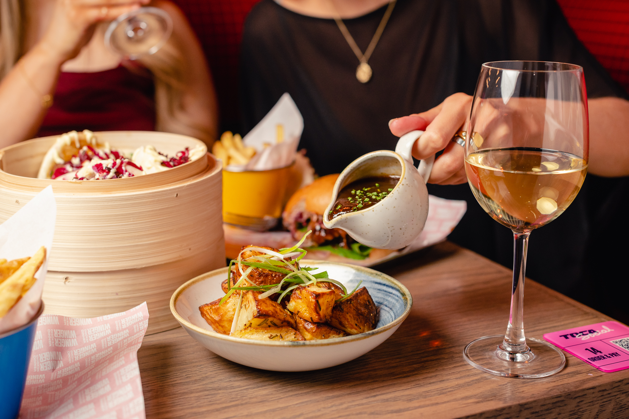 Vibrant dining at Players Lounge, TOCA Social, ideal for networking events and gatherings.