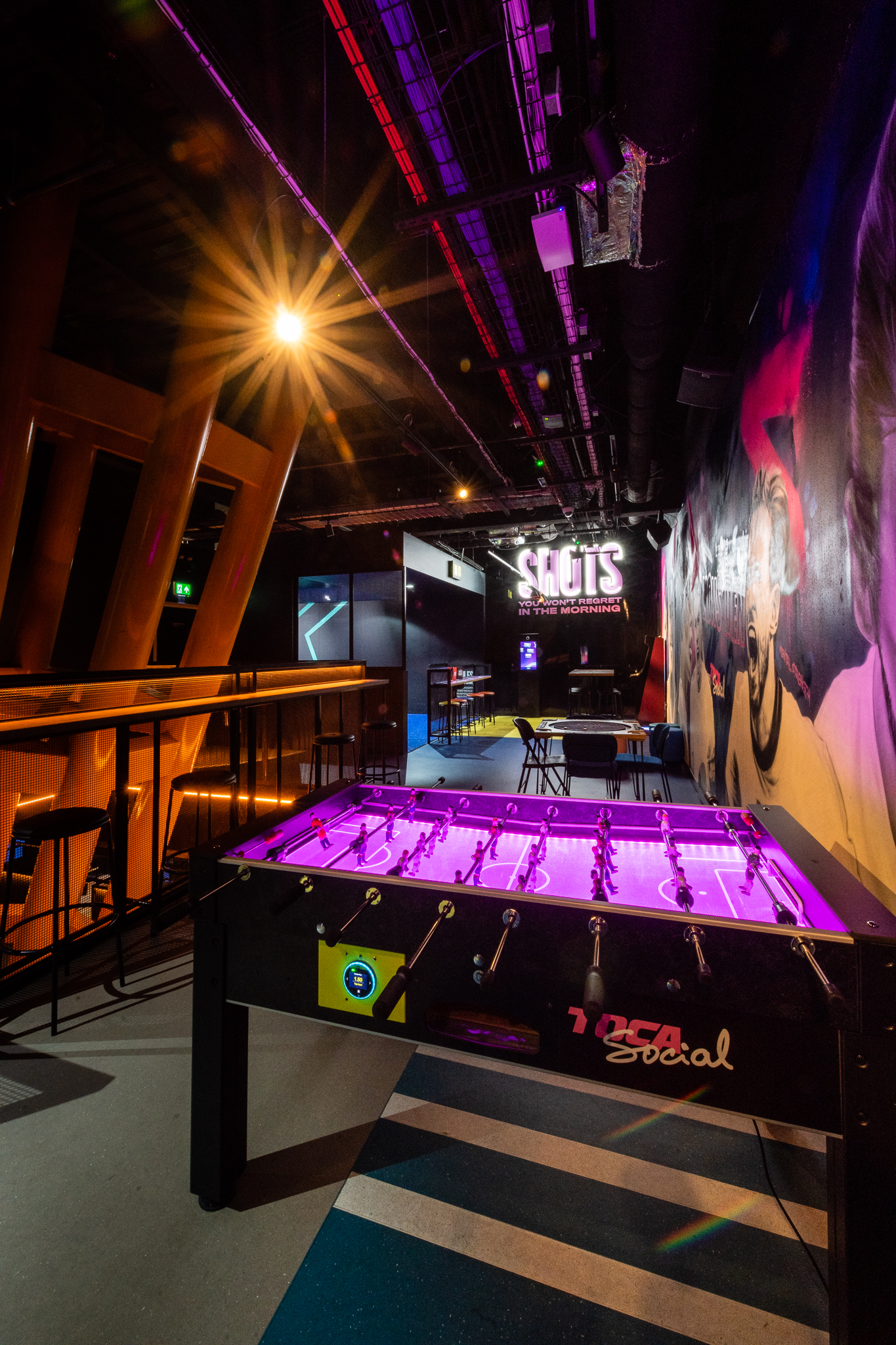 Vibrant TOCA Social event space with foosball table for networking and team-building.