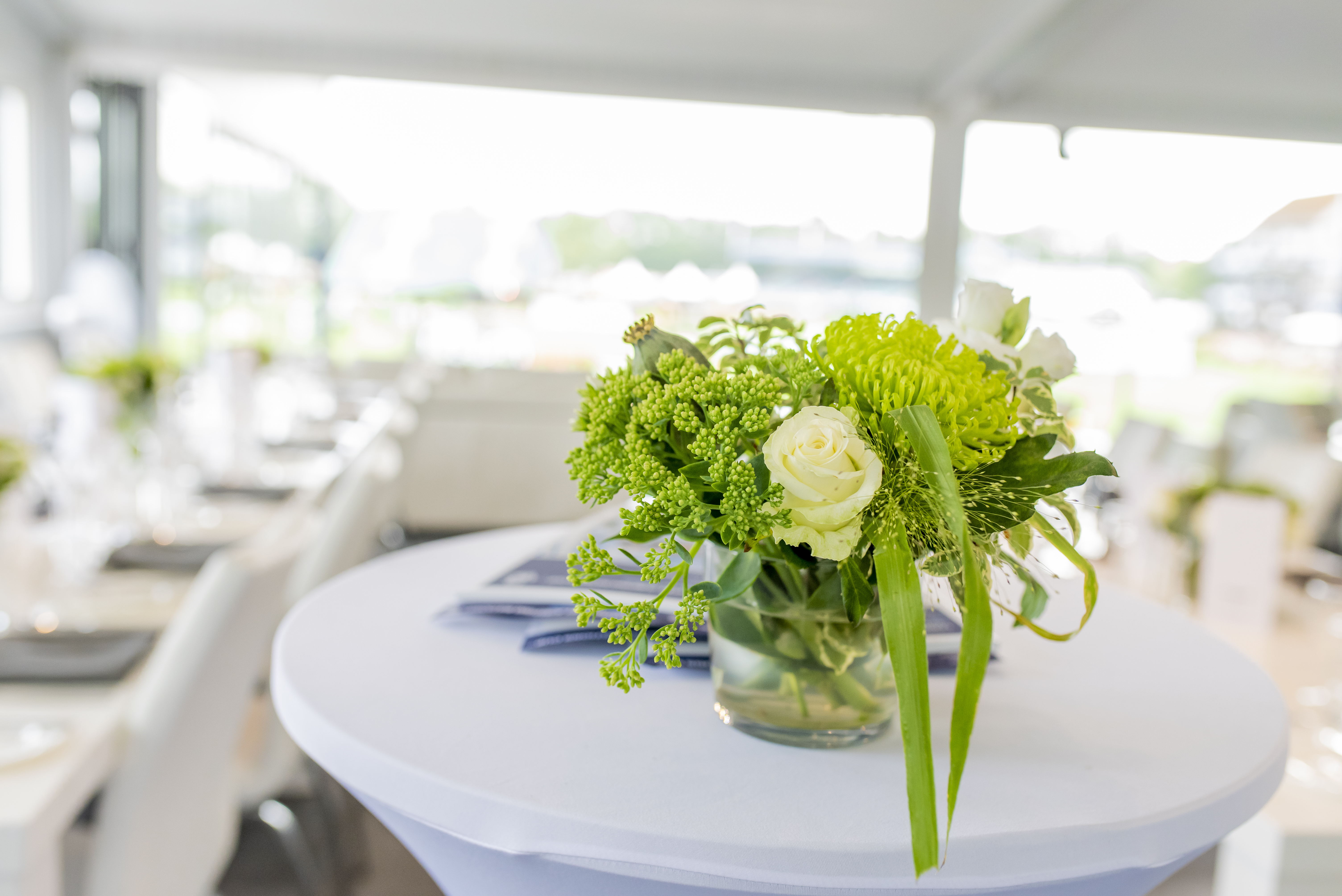 Elegant floral centerpiece in Al Shira'aa Suite, perfect for events and networking.