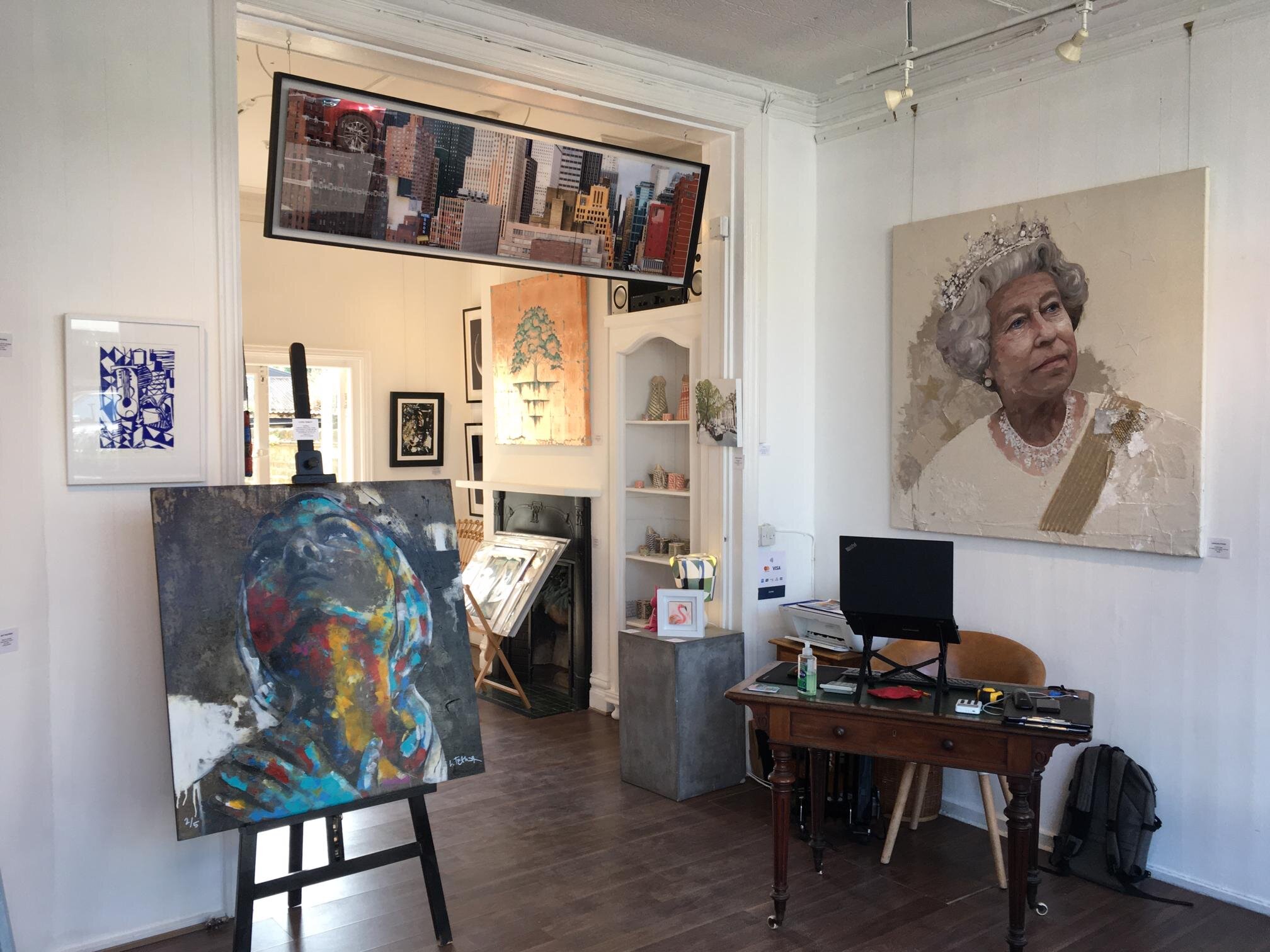 Vibrant art gallery with eclectic artwork, ideal for creative meetings and workshops.