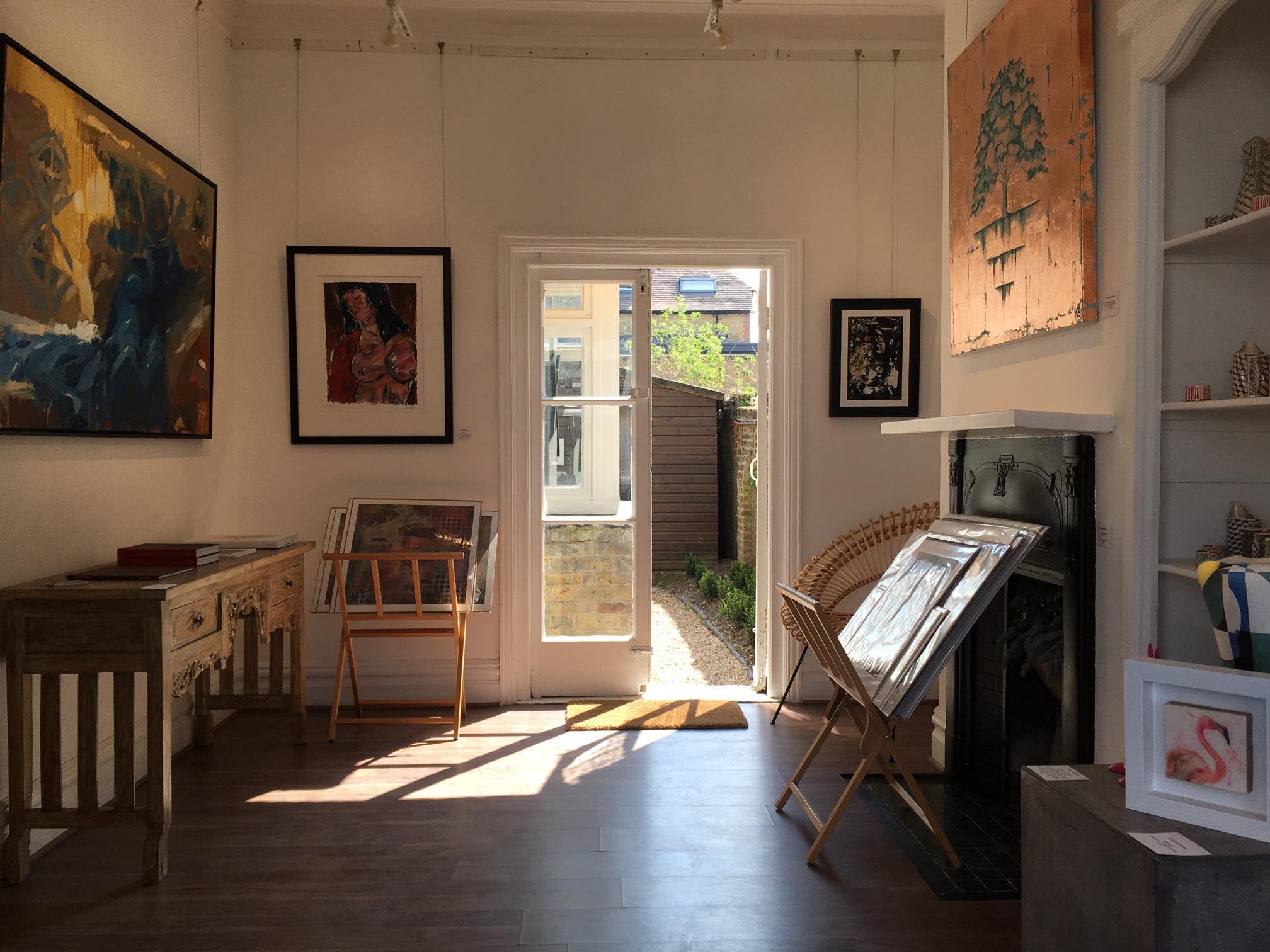 Bright gallery space with natural light, ideal for art events and creative workshops.