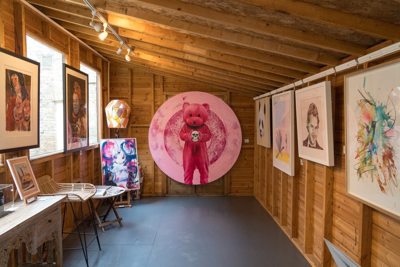 Garden gallery in Ad Lib Gallery with pink bear centerpiece, ideal for art exhibitions and events.
