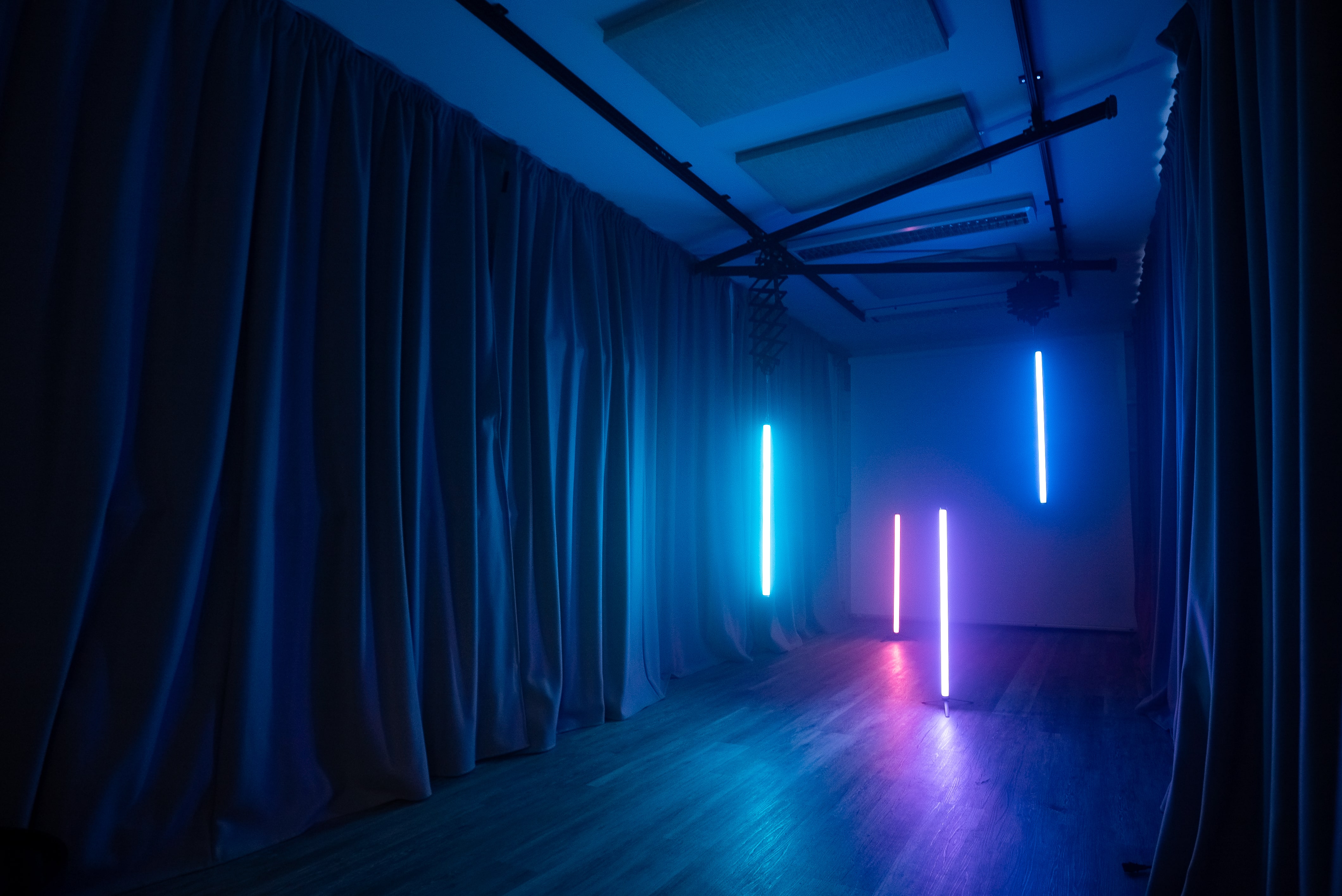 Modern event space with ambient lighting, ideal for product launches and workshops.