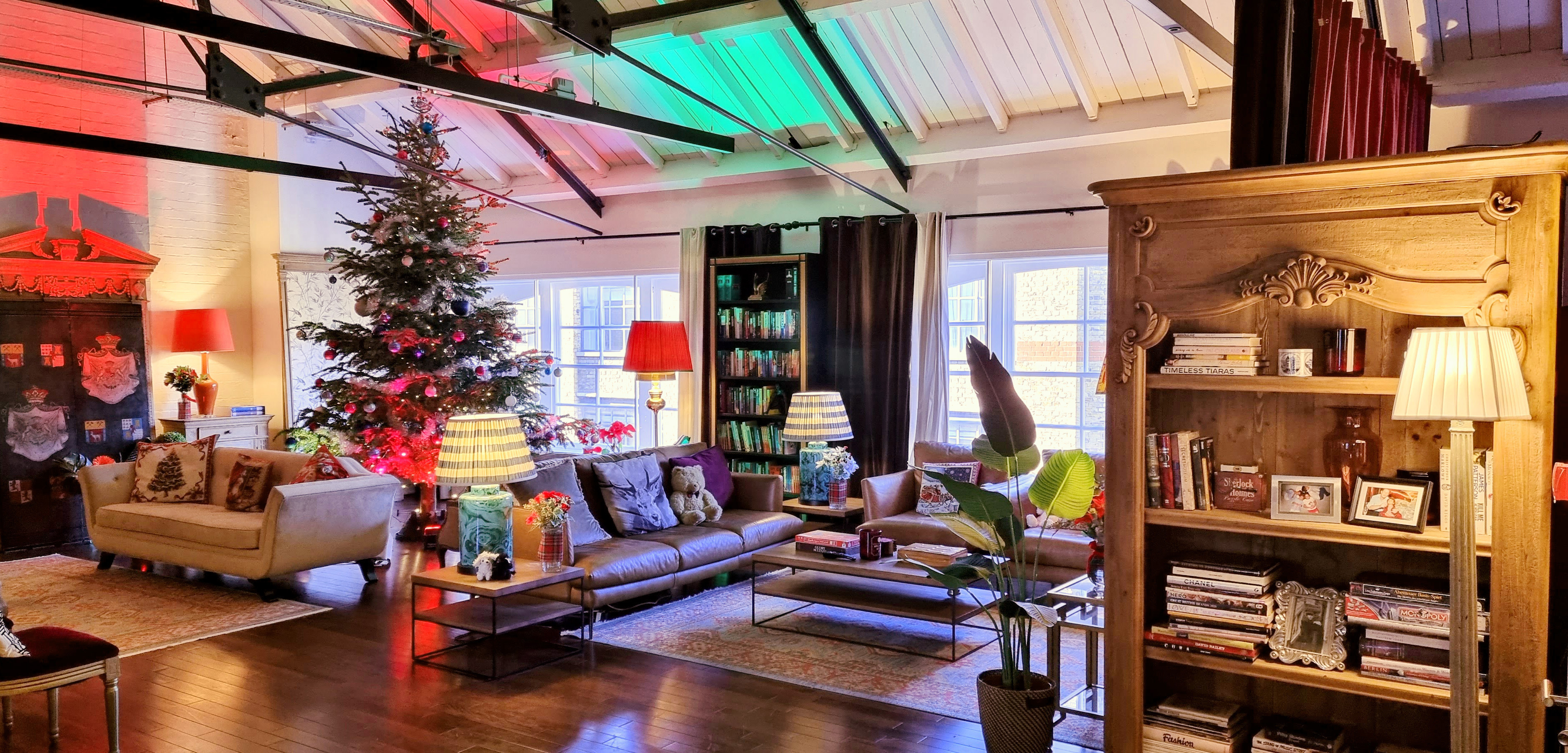 Cozy event space at The Chalet with festive Christmas tree for intimate gatherings.