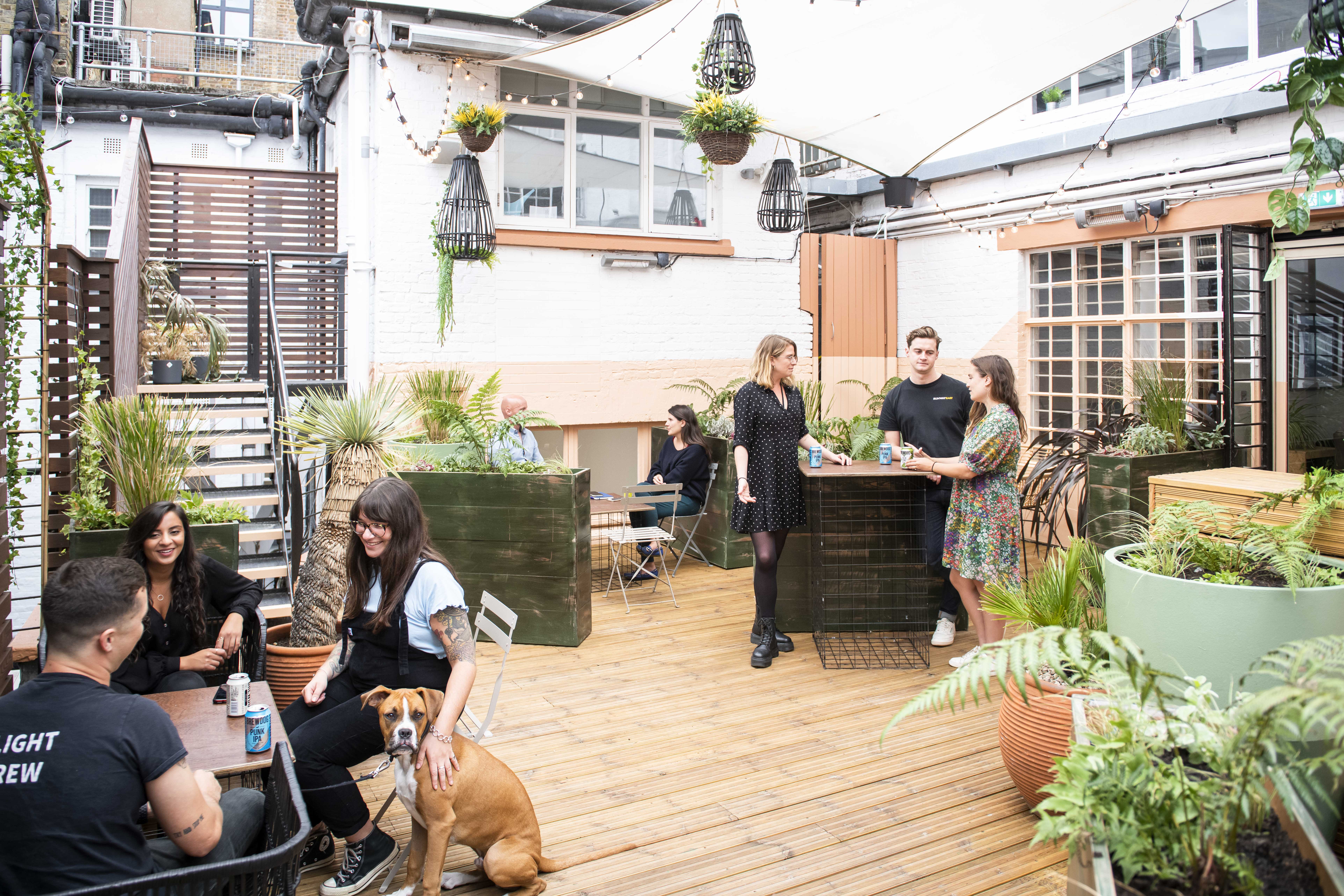 Vibrant outdoor terrace at Runway East Soho, perfect for casual meetings and networking events.